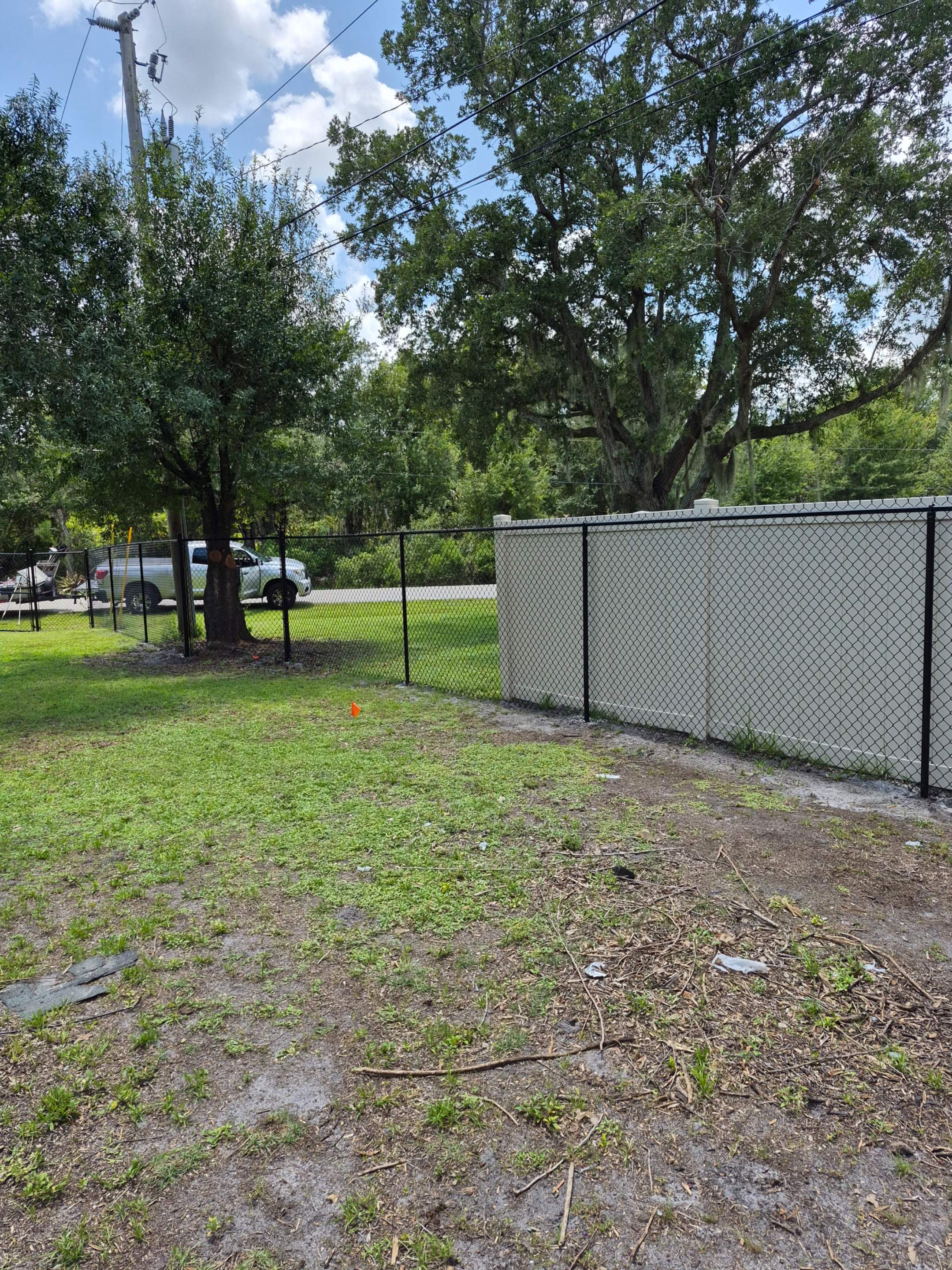 Black Chain Link Perimeter Fencing with Double Gates in Port Charlotte by True Fence LLC