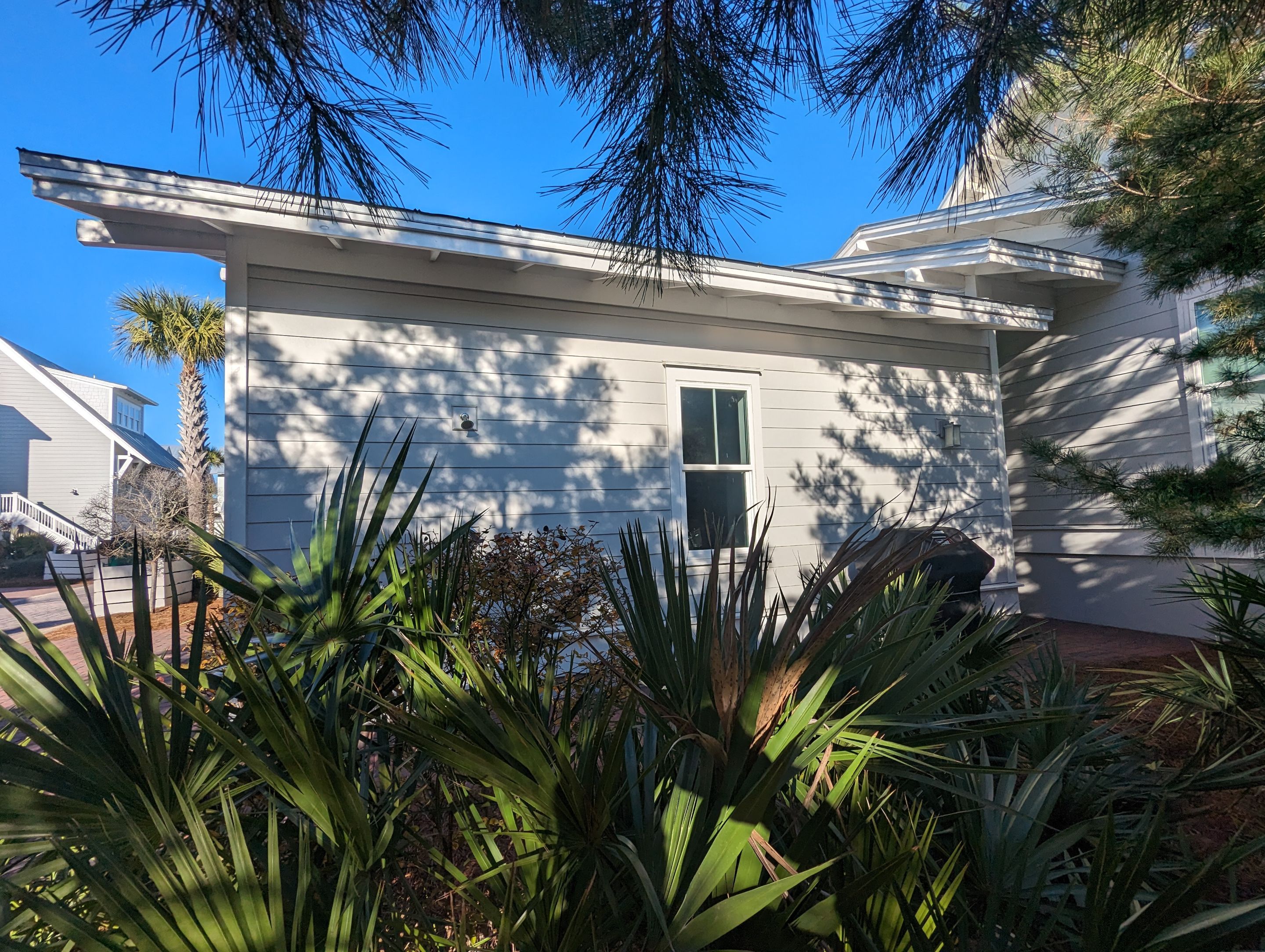 White Half-Round Gutters Installation in Rosemary Beach, FL by Gutter Professors