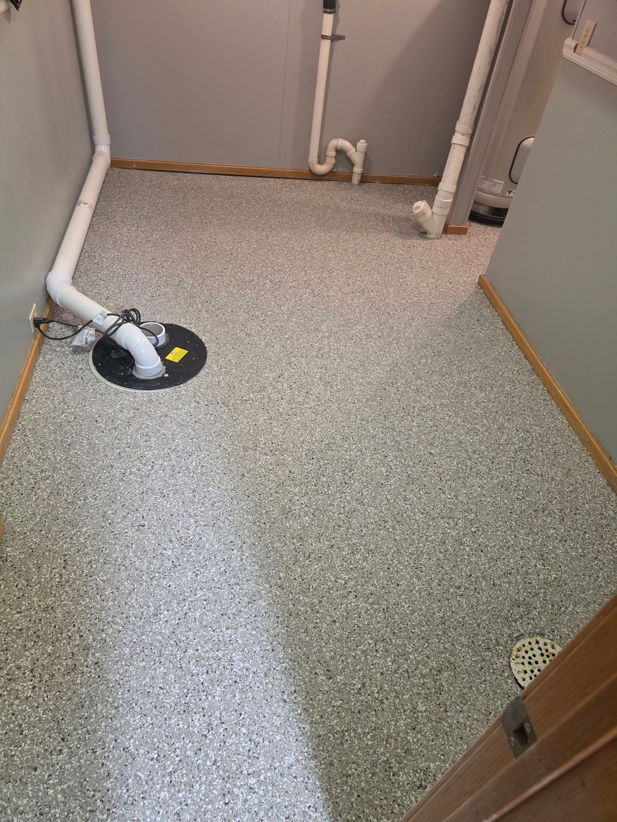 Full Garage and Basement Epoxy Floor Coating in Winner by Select Painting, Coatings & Garage Cabinets