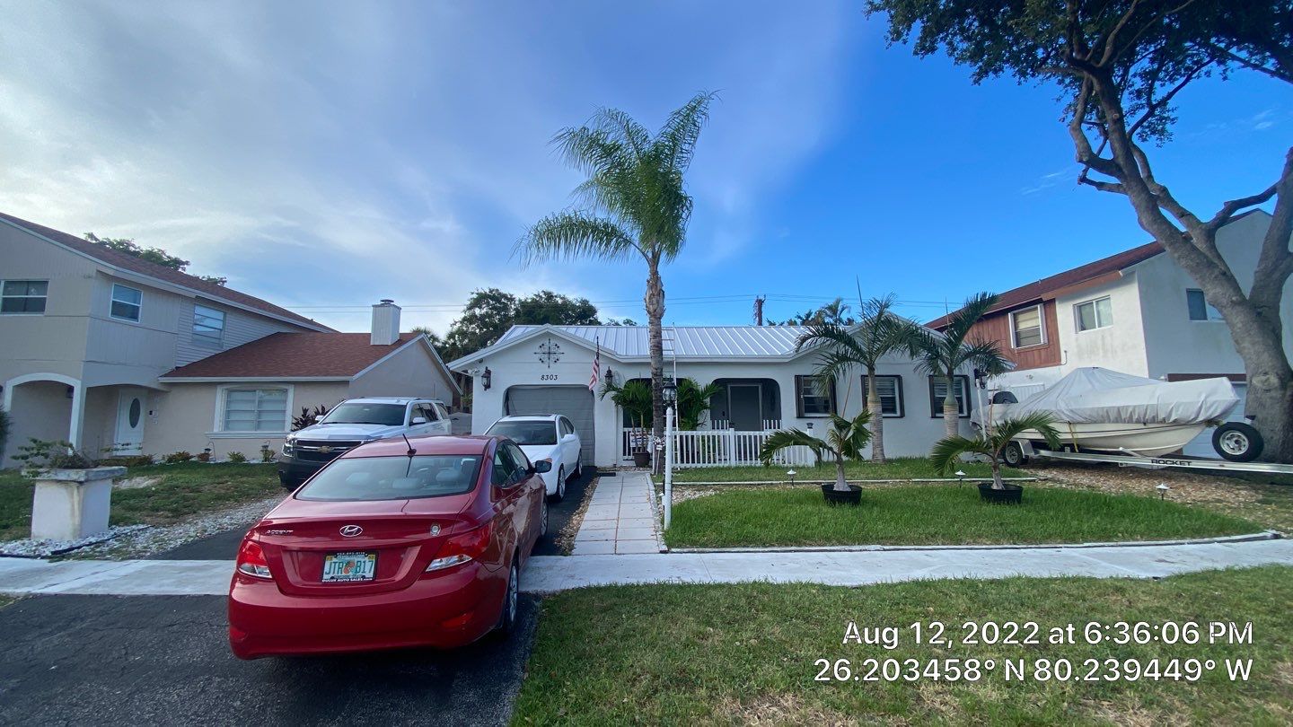 Residential Roofing Installation using 1.5" Nail Strip 24ga Solar White Kynar Coated Standing Seam Metal Panels by Morton Roofing, Inc.