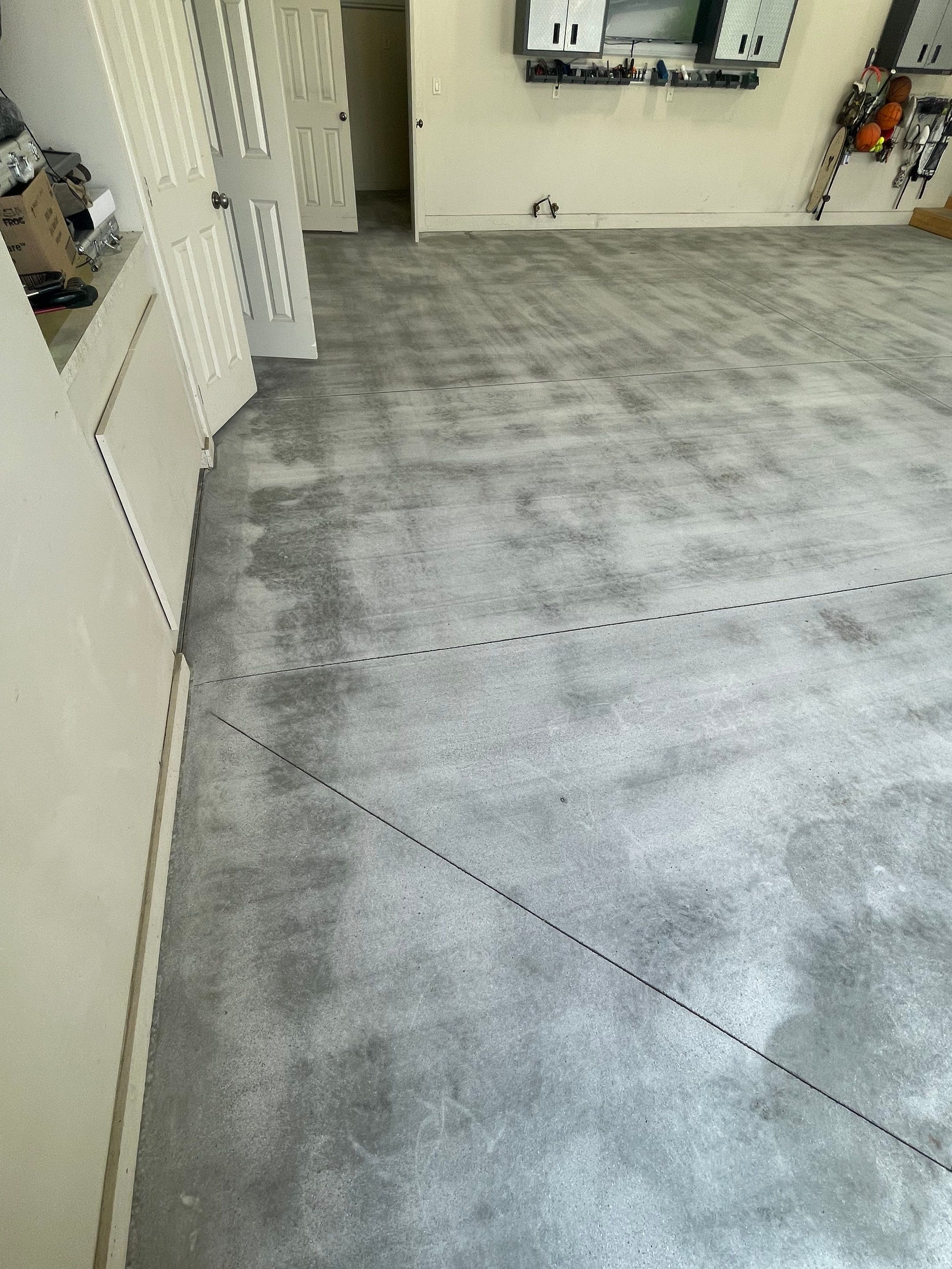 Coyote Flake Garage Floor Coating in Sioux Falls with Trench Drain by Select Painting, Coatings & Garage Cabinets