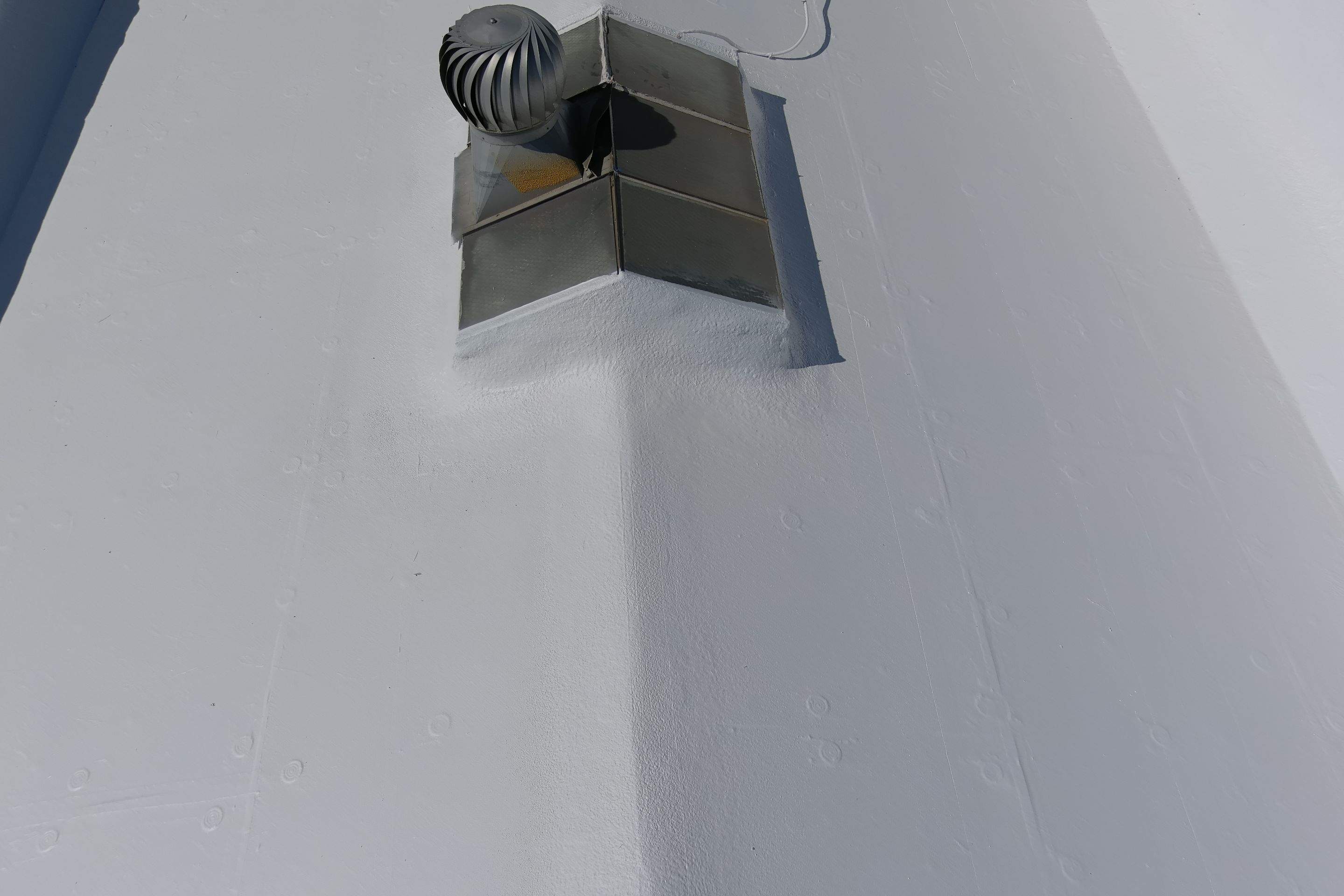 Commercial Roofing Installation using Conklin BenchPly system with PUMA top coat (imbedded fabric system) by Straight Edge Roofing Inc