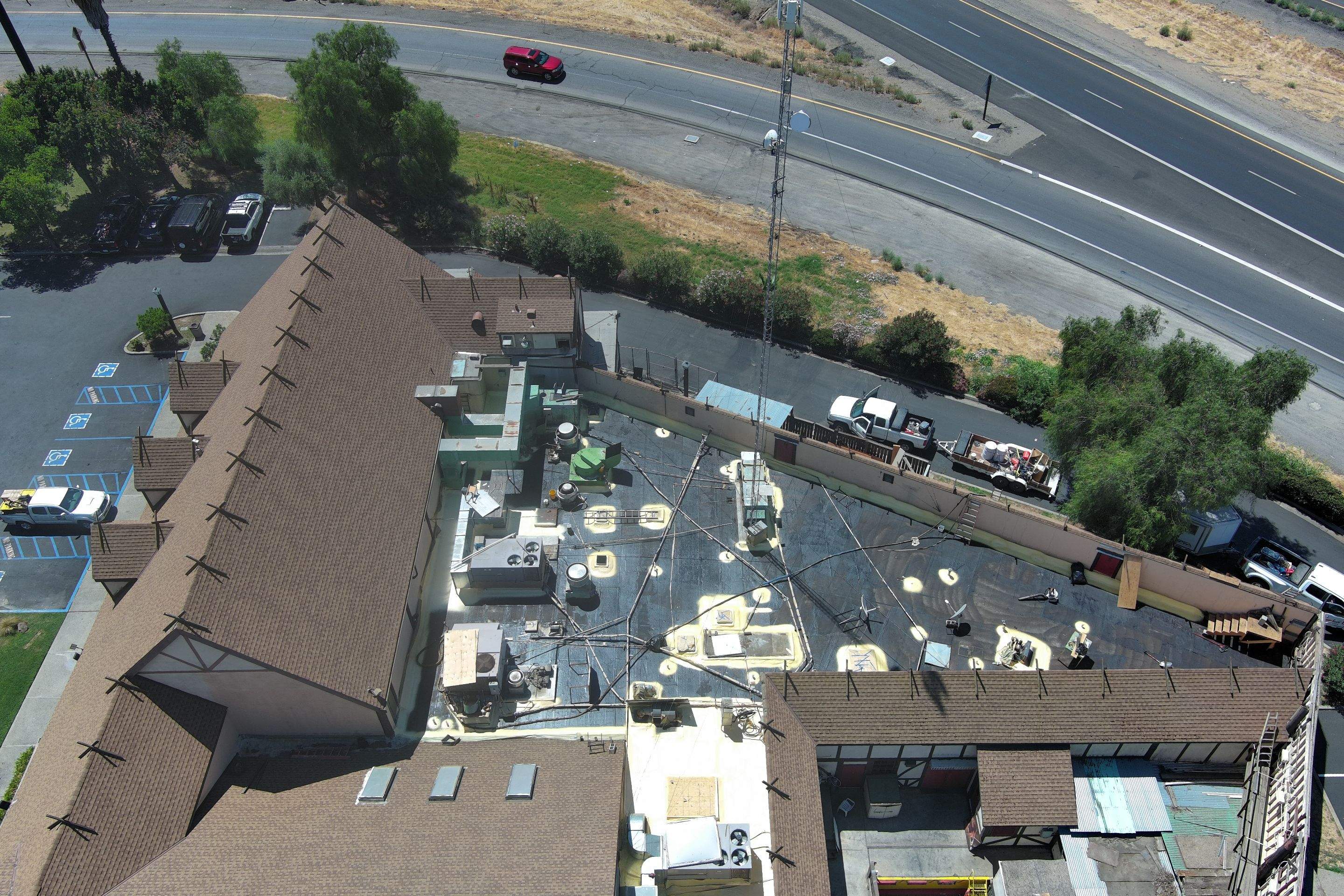 Spray foam and coatings using General Coatings acrylic coatings and spray foam by Straight Edge Roofing Inc