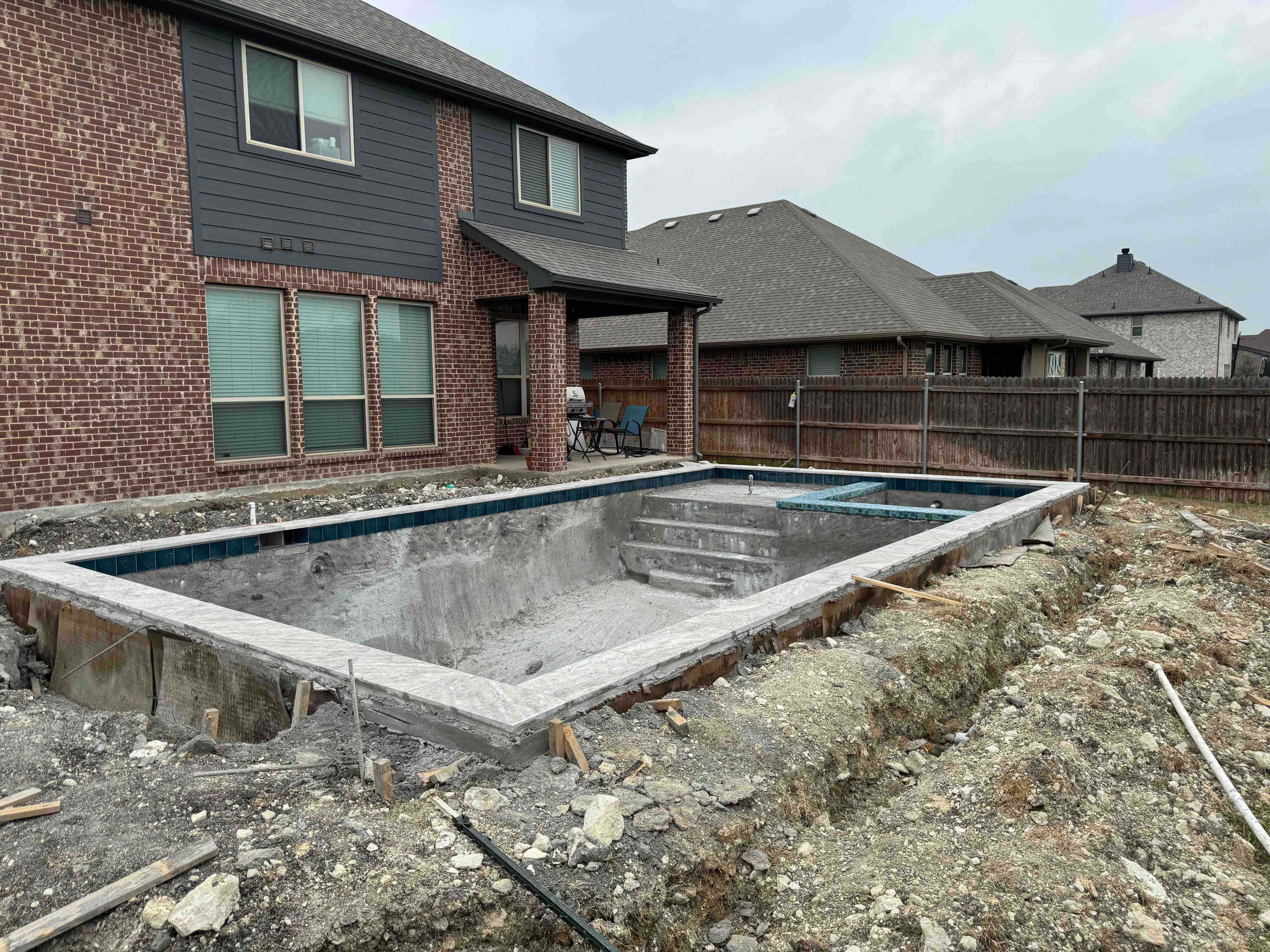 Geometric Pool with Tanning Ledge by Pinnacle Pools and Spas - DFW