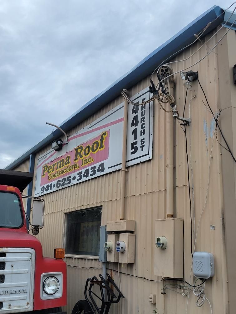 Black Aluminum Gutters with Matching Downspouts in Port Charlotte, FL by Gutter Professors
