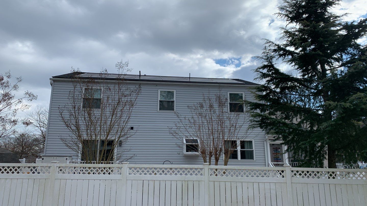 Roof Replacement with GAF Decotech integrated solar panels by American Home Contractors