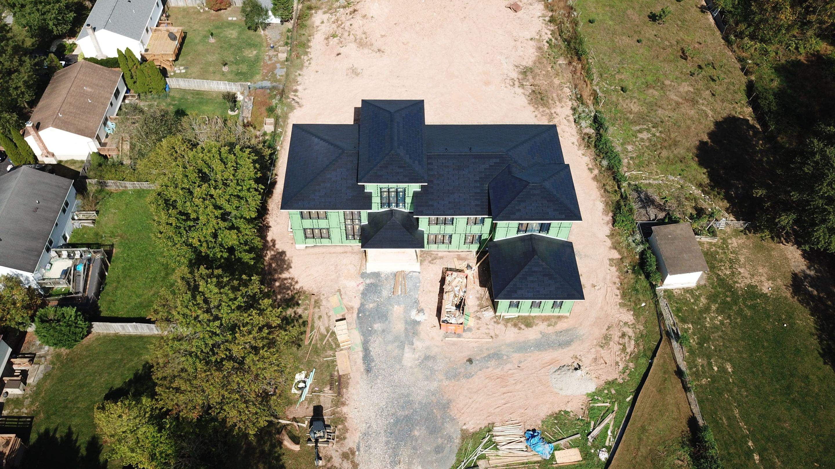 Tesla Solar Roof  using Tesla Solar Roof V3 tiles by American Home Contractors