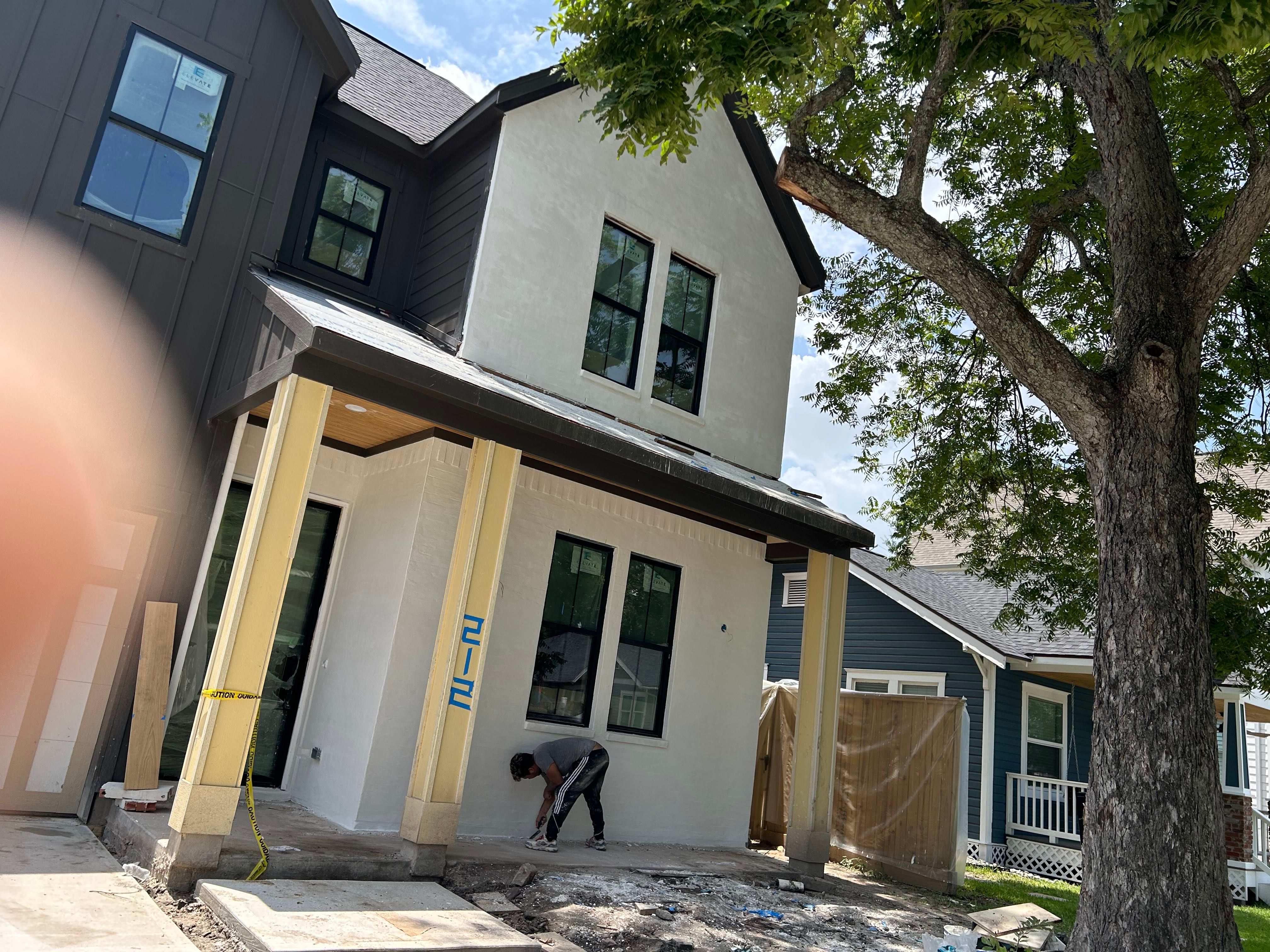 Midtown Elegance: Brickwork with Slurry Finish Refinement by Apex Conventional Stucco Llc