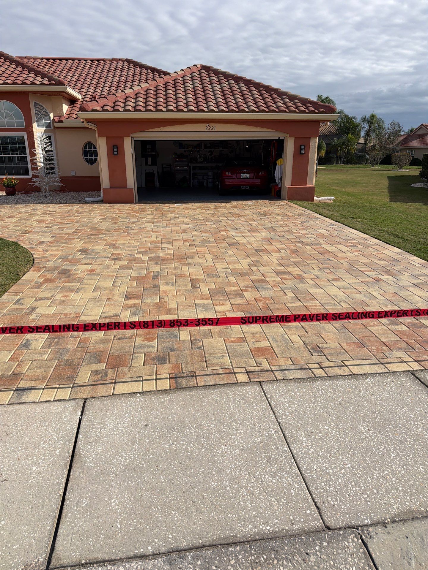 Professional Paver Sealing for this beautiful Driveway in Sun City Center by Supreme Paver Experts
