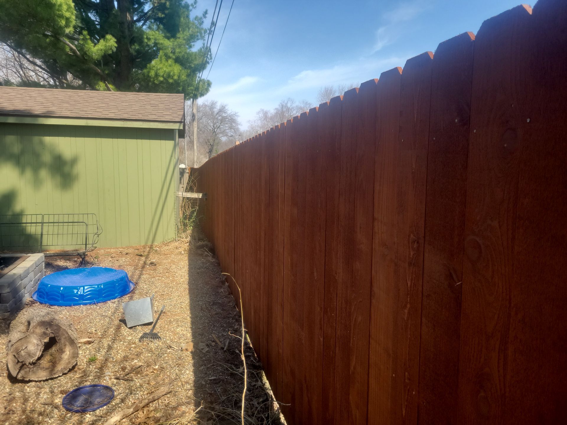 Stained Cedar Wood Privacy Fence Installation in Cedar Falls by Perfect Picket Fence and Stain