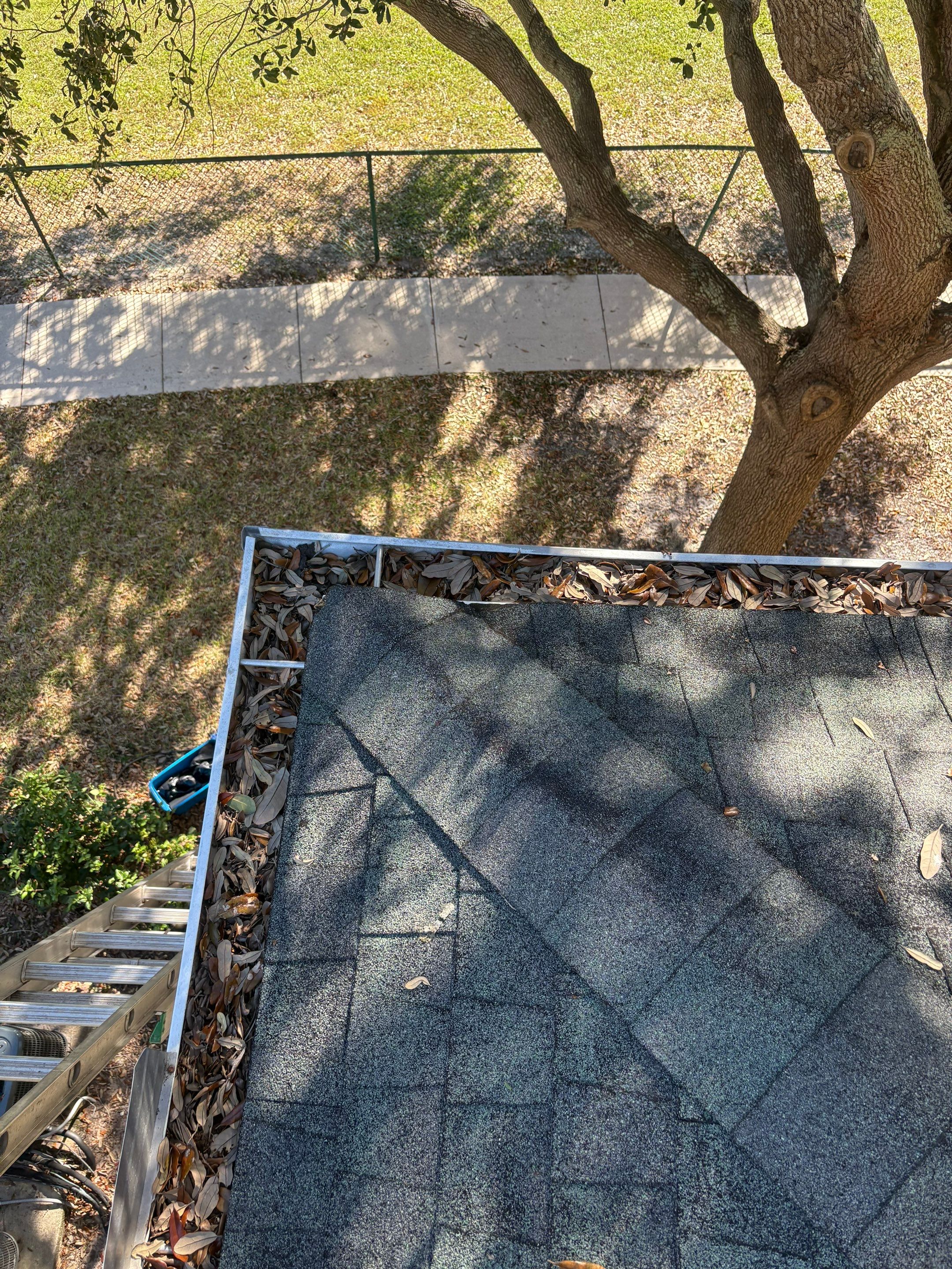 Commercial gutter cleaning Palm Bay & Melbourne, before photo with filled gutters