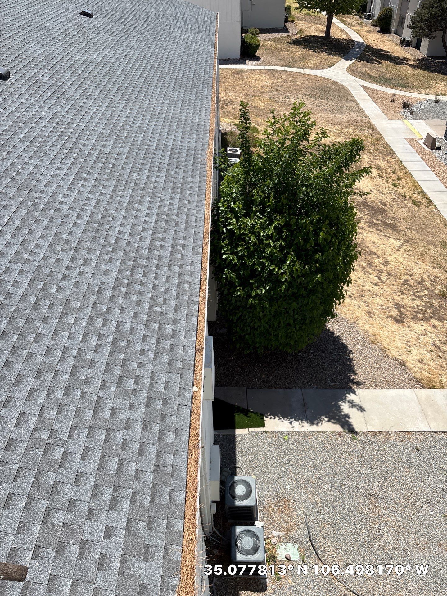 Commercial gutter cleaning Albuquerque before photo with filled gutters