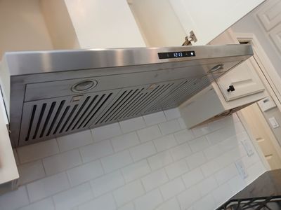 Under-Cabinet Range Hood Installation with Vent Ducting in Austin