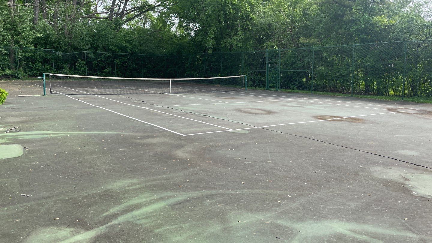 Tennis Court using Algaecide, soft wash soap by Northern Power Washing LLC.