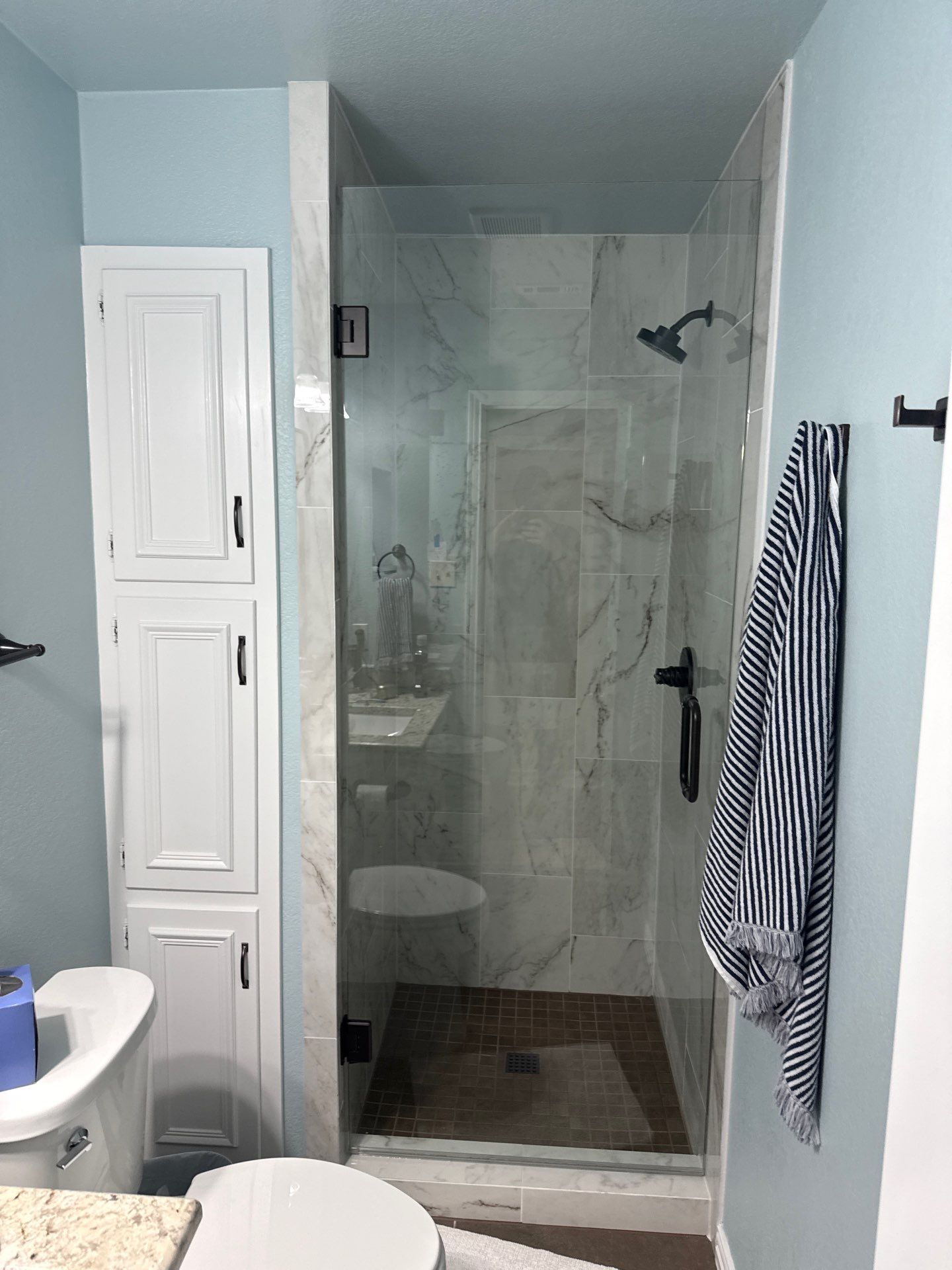 Bathroom Remodel with Marble Tile and Granite Vanities in Argyle by Simmons Floors