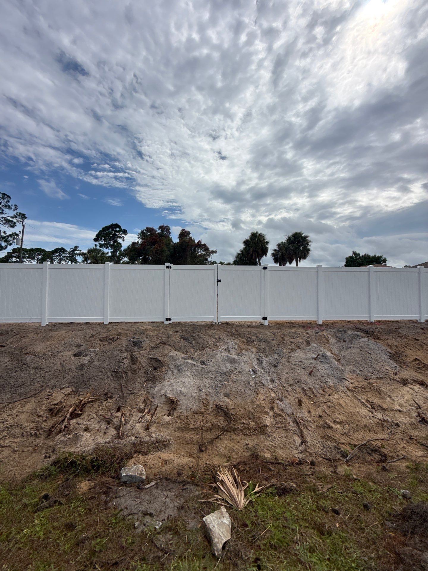 White Vinyl Privacy Fence Installation in North Port Florida by True Fence LLC