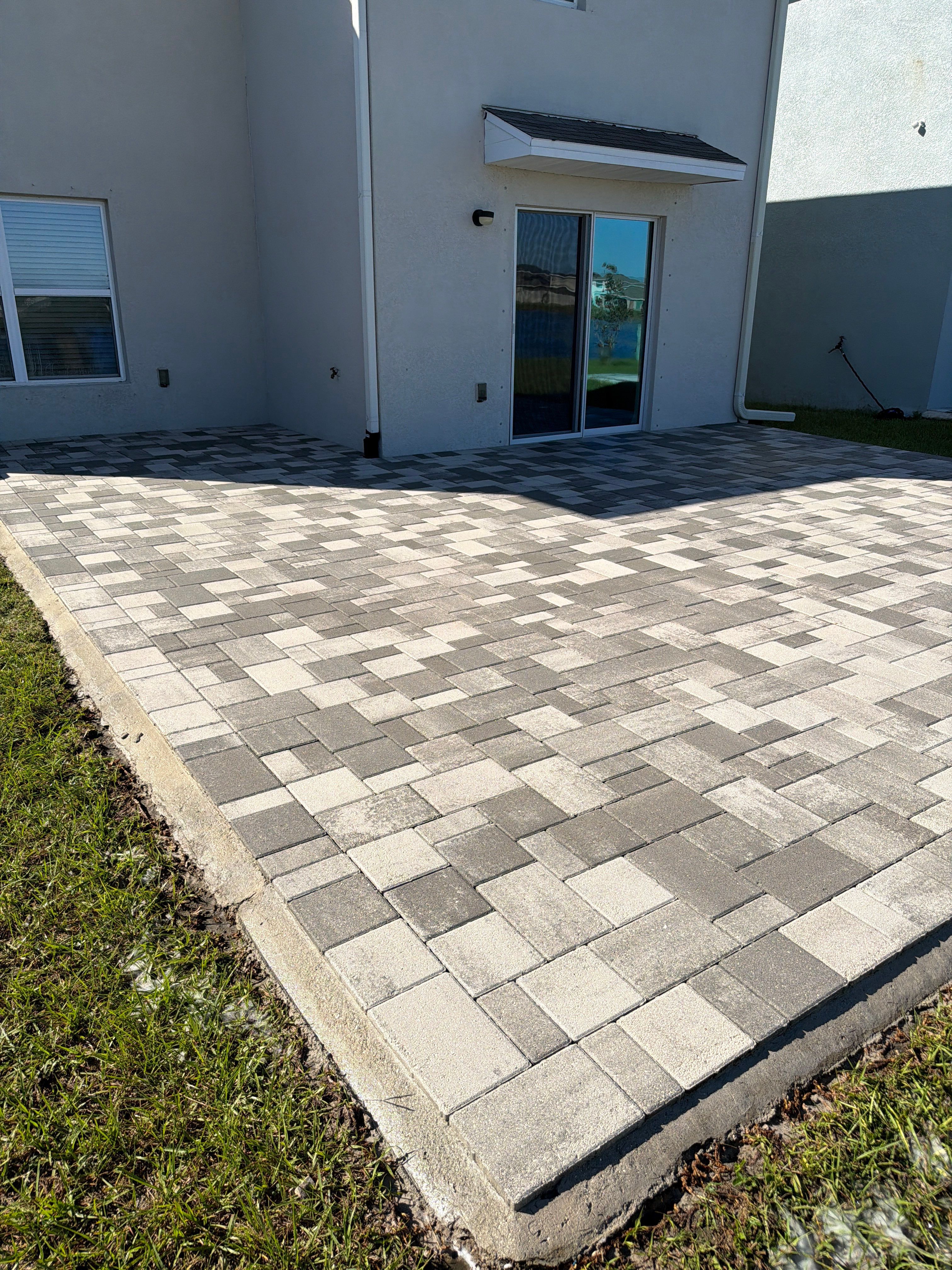 Paver Sealing and Restoration for Large Multi-Toned Patio in Wimauma by Supreme Paver Experts