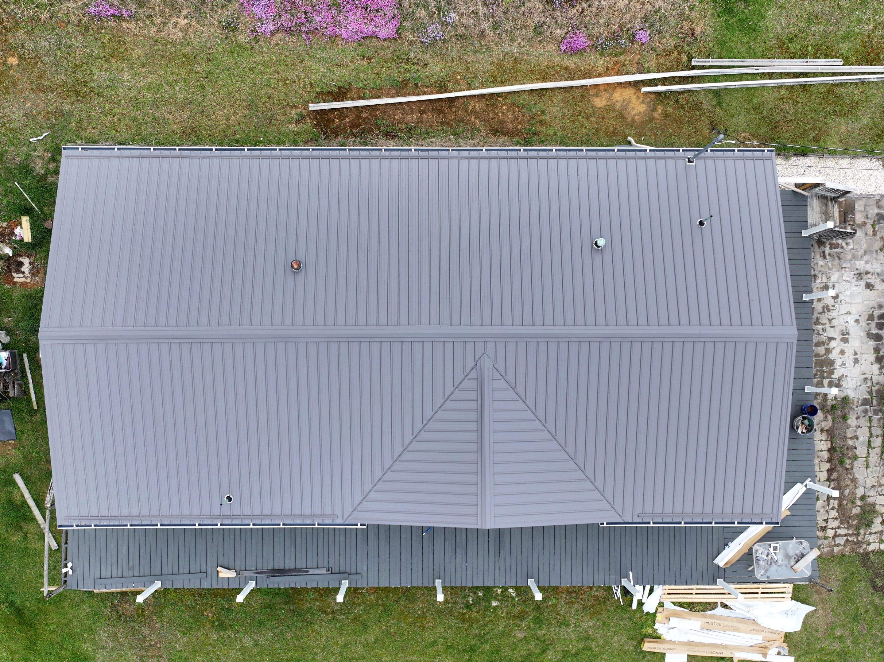 Charcoal Gray Textured Metal Roof by Omnia Roofing
