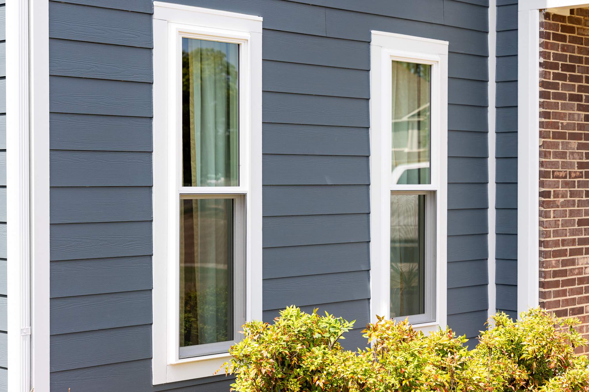 Evening Blue Hardie + Windows by Freedom Exteriors