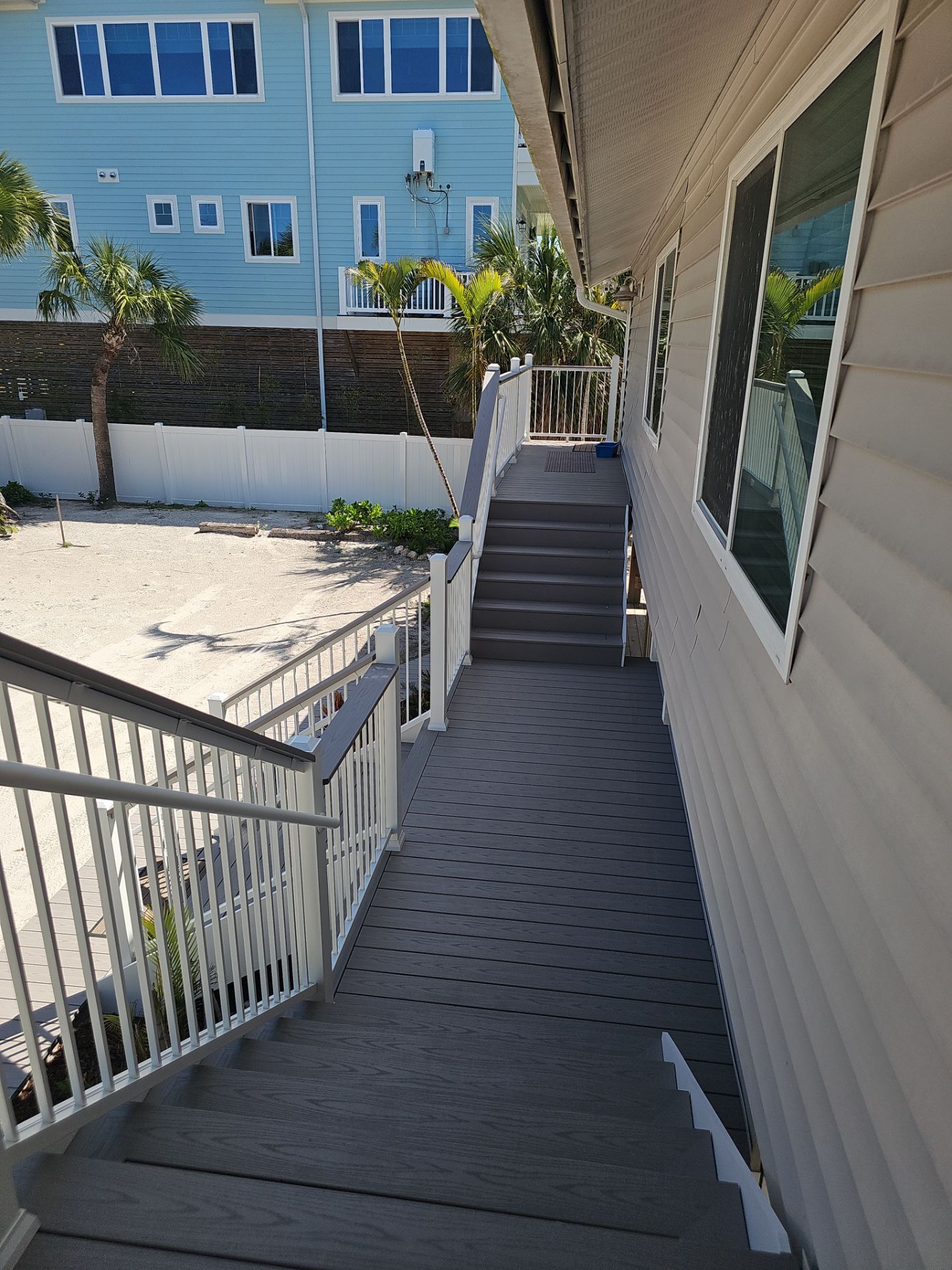 Elevated Composite Deck and Symmetrical Staircase Replacement in Englewood by Smirnov Construction Inc