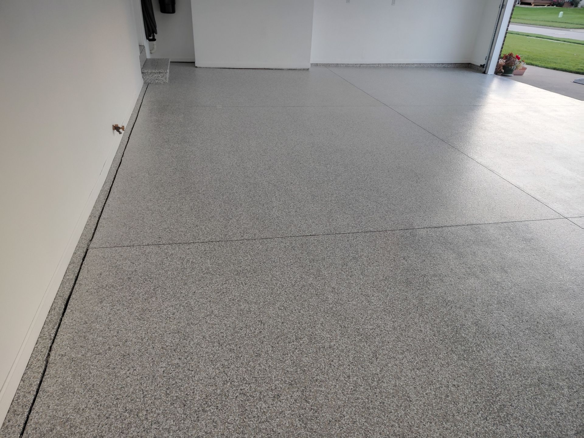 New Johnston Garage Resurfacing by Revival Concrete Coatings, LLC