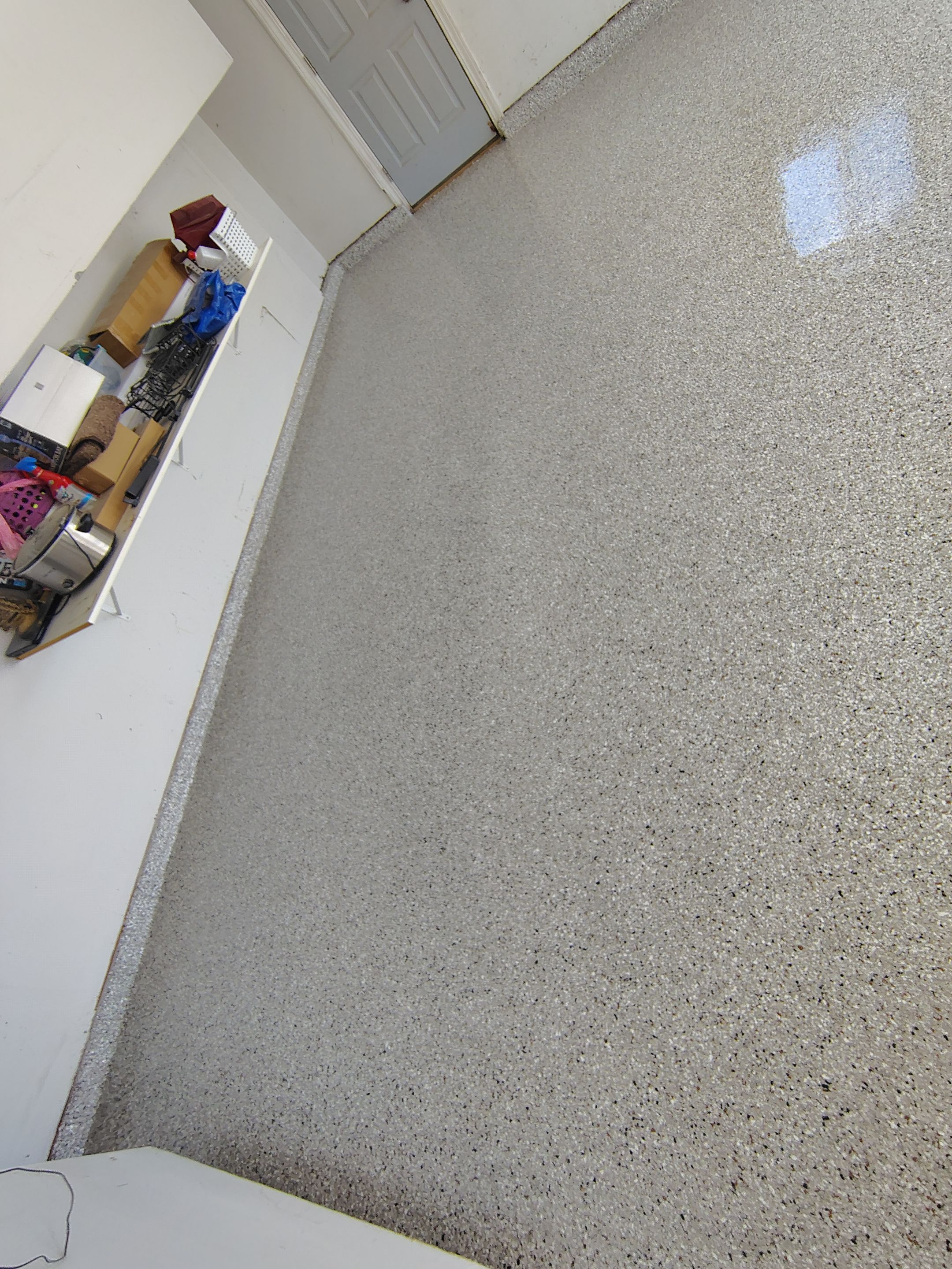 Decorative Chip Epoxy Garage Floor Coating in Sioux Falls by Select Painting, Coatings & Garage Cabinets