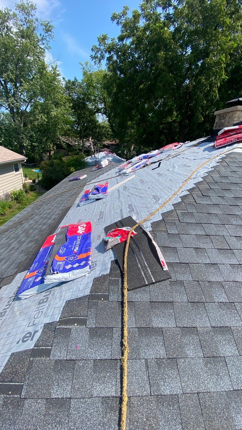 Asphalt Roof Replacement by Custom Installations