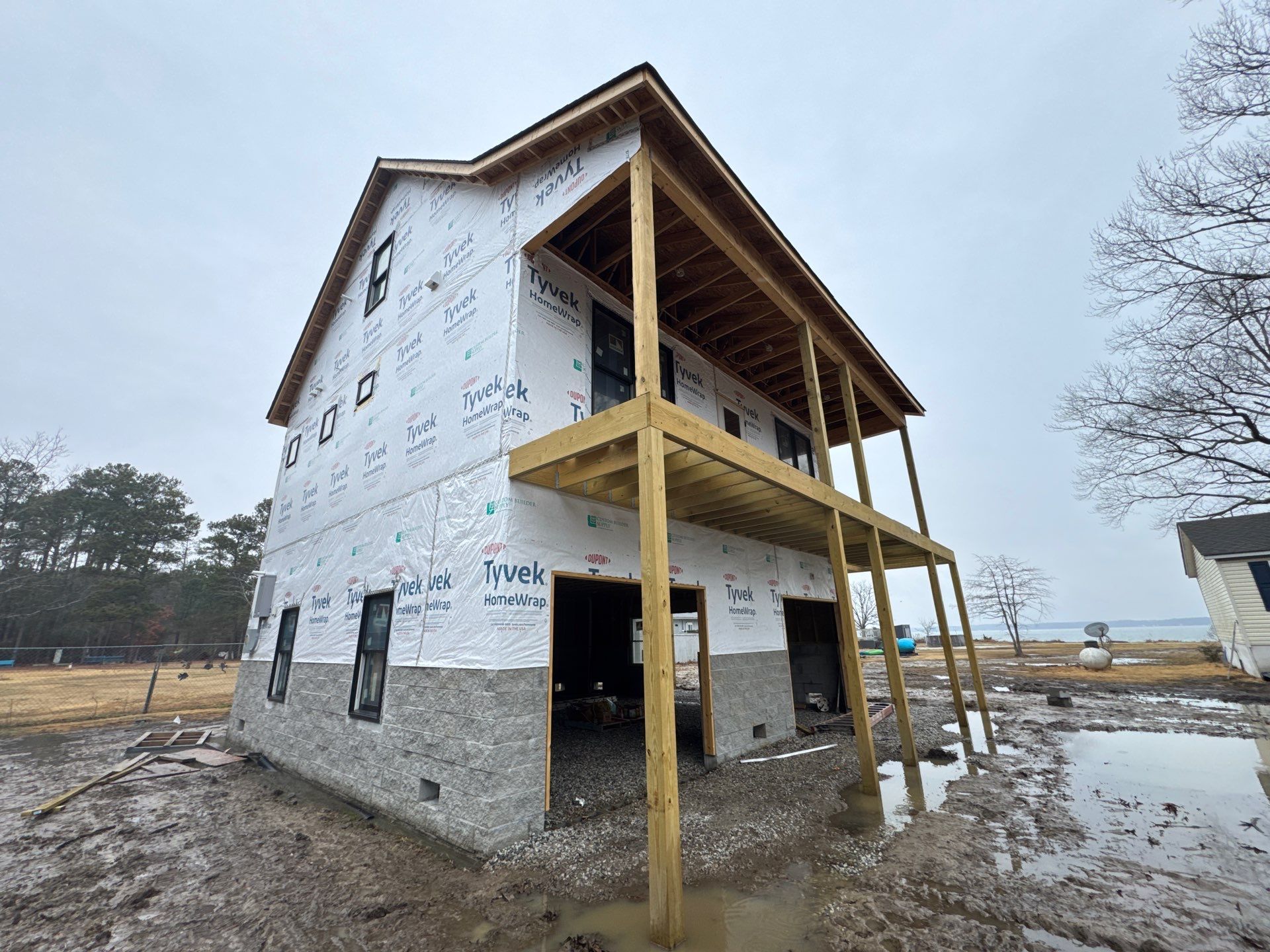 Two-Story Custom Home With Board and Batten Siding by Cade Construction