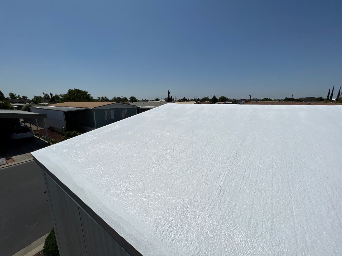 Spray foam and coatings using General Coatings acrylic coatings and spray foam by Straight Edge Roofing Inc