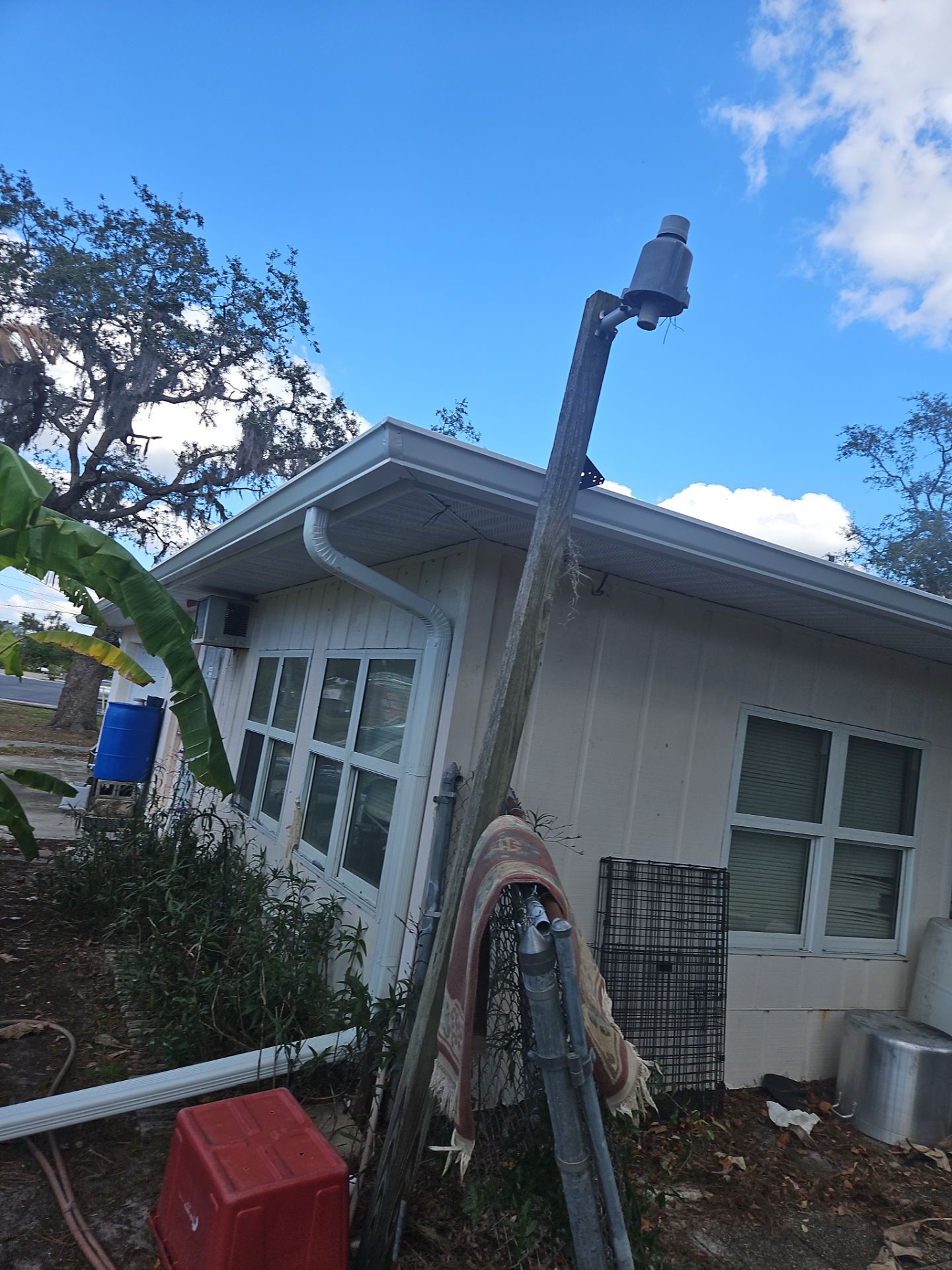 Downspout Installation using White Down Spouts in Sarasota FL by Gutter Professors