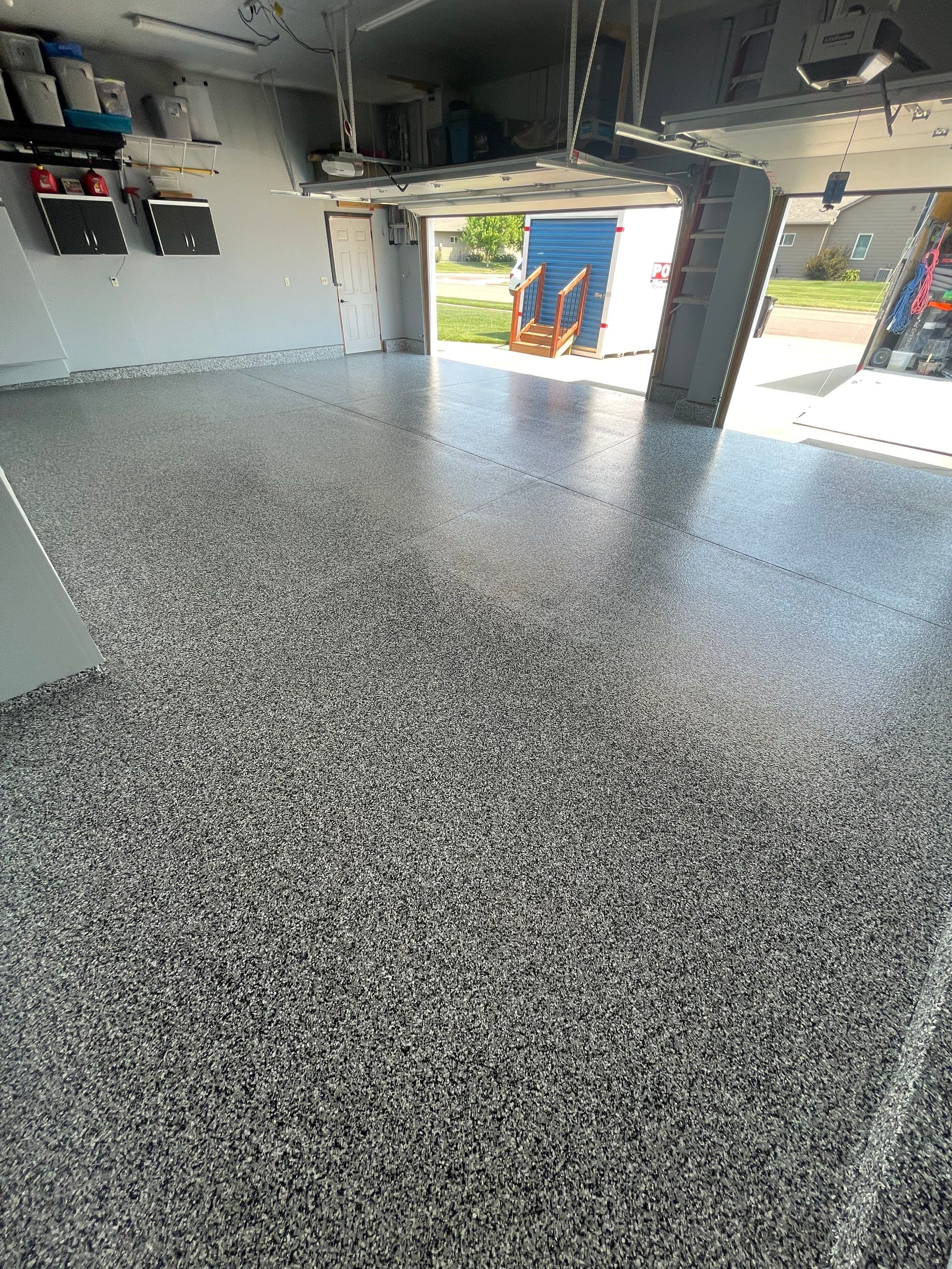 Sioux Falls Garage Concrete Coating Installation with Domino Flake by Select Painting, Coatings & Garage Cabinets
