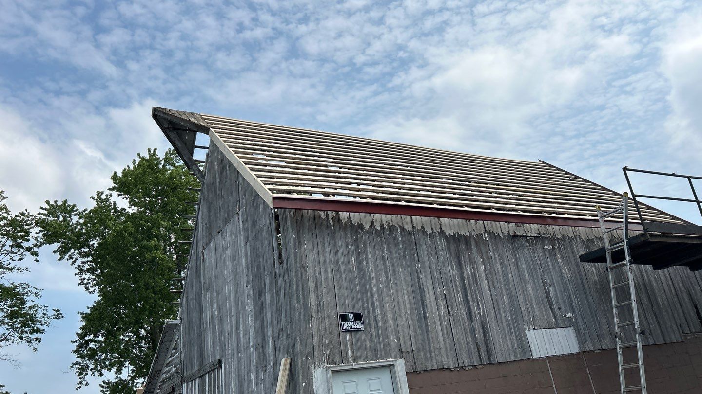 Residential Roofing Installation using Standing Seam Metal - Barn Red by RoofX 