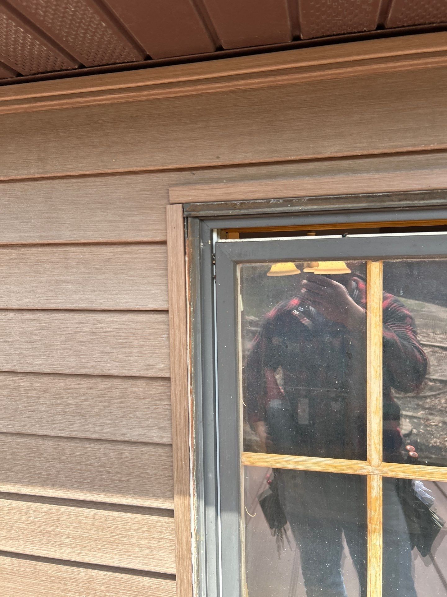 Pella Window installation using Pella Lifestyle wood/Aluminum window by United Windows and Siding LLC