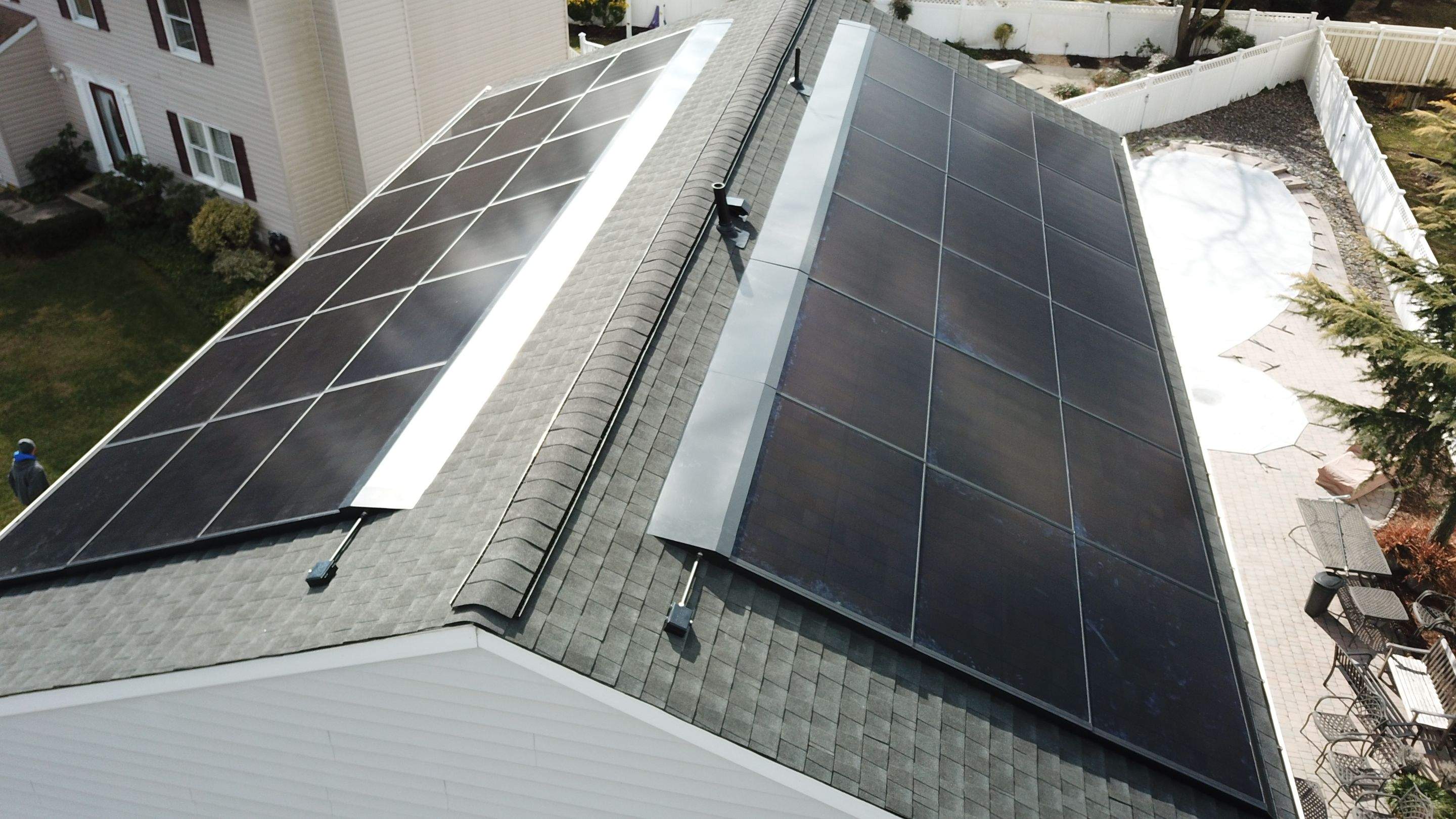 Roof Replacement with GAF Decotech integrated solar panels by American Home Contractors