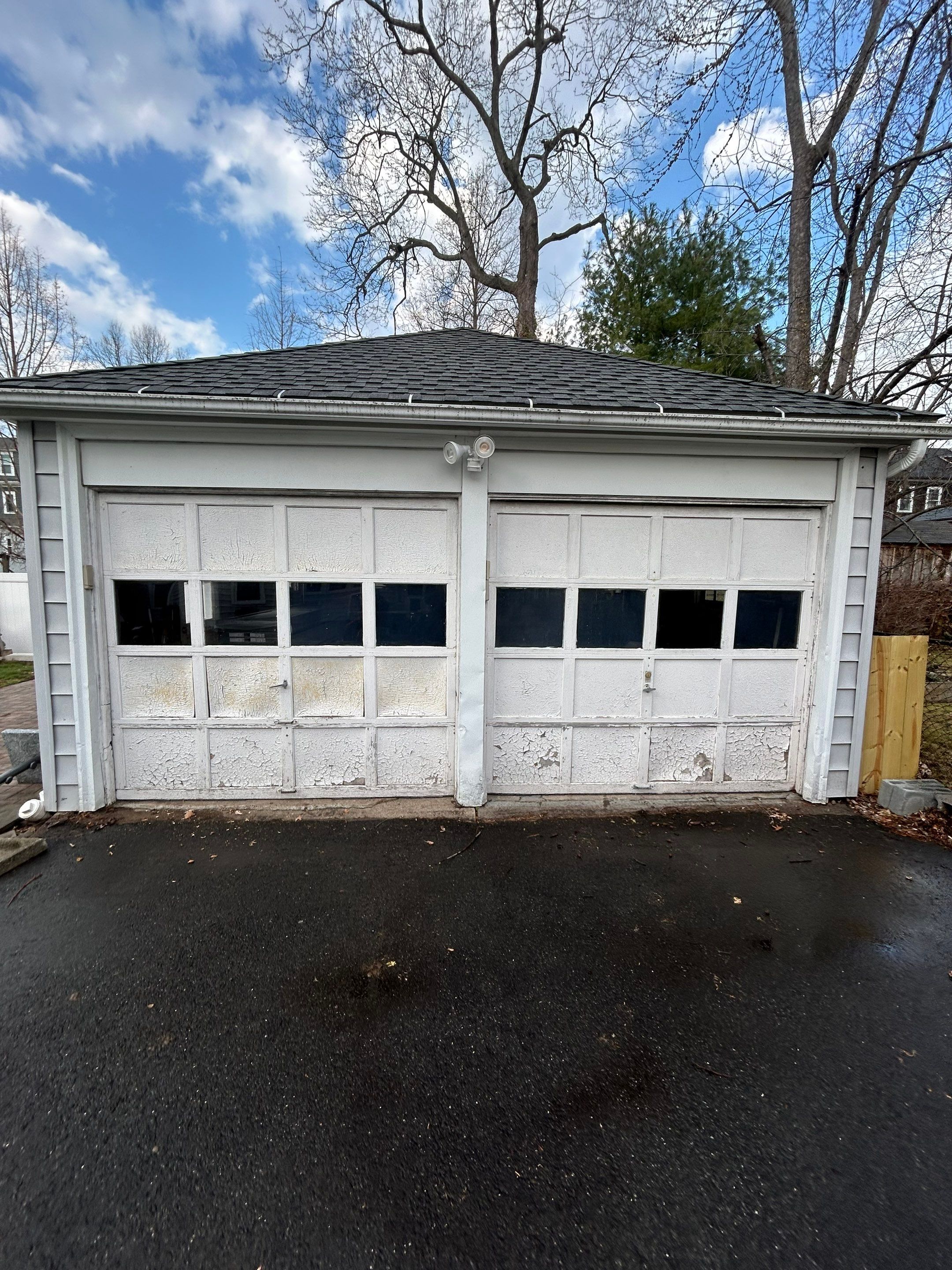 Double Garage Door Upgrade for a Clean, Unified Look by DiGiorgi Roofing and Siding Inc
