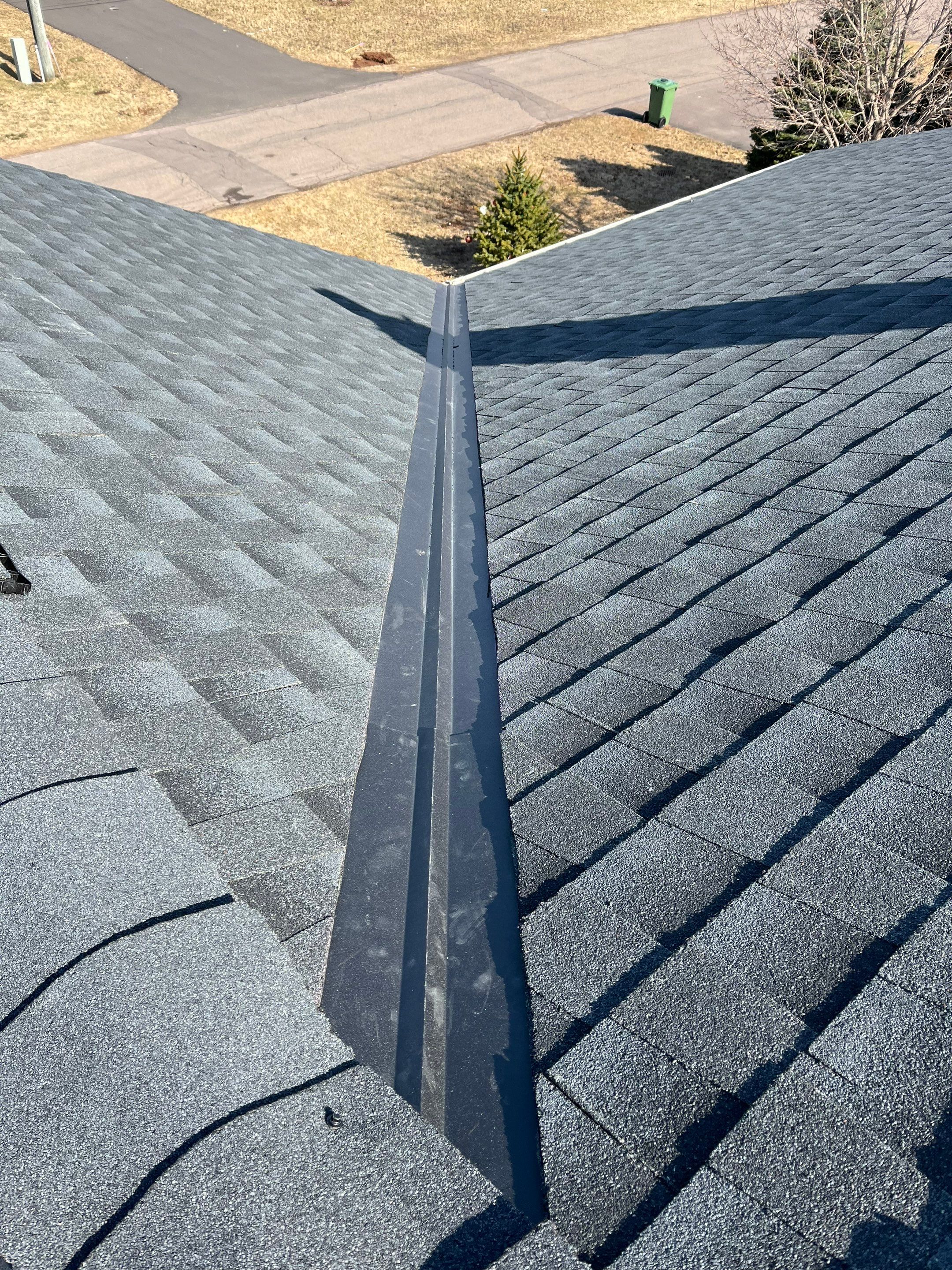 Residential Roofing Installation using Asphalt GAF HDZ in Charcoal by Artisan Roofing & Home Improvements Inc.