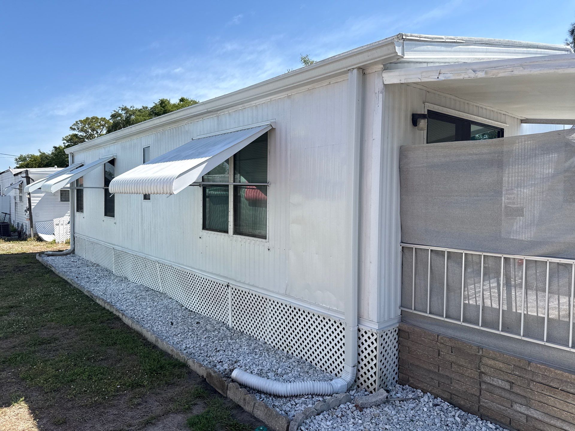 Mobile Home Soft Wash & TPO Roof Cleaning in Plaza Estates – Bradenton, FL by Sunshine AquaWash