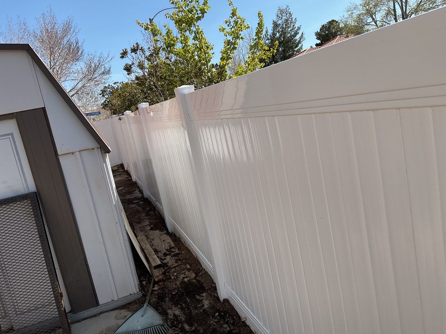Fence installation using vinyl material by Fence Guys Inc. 