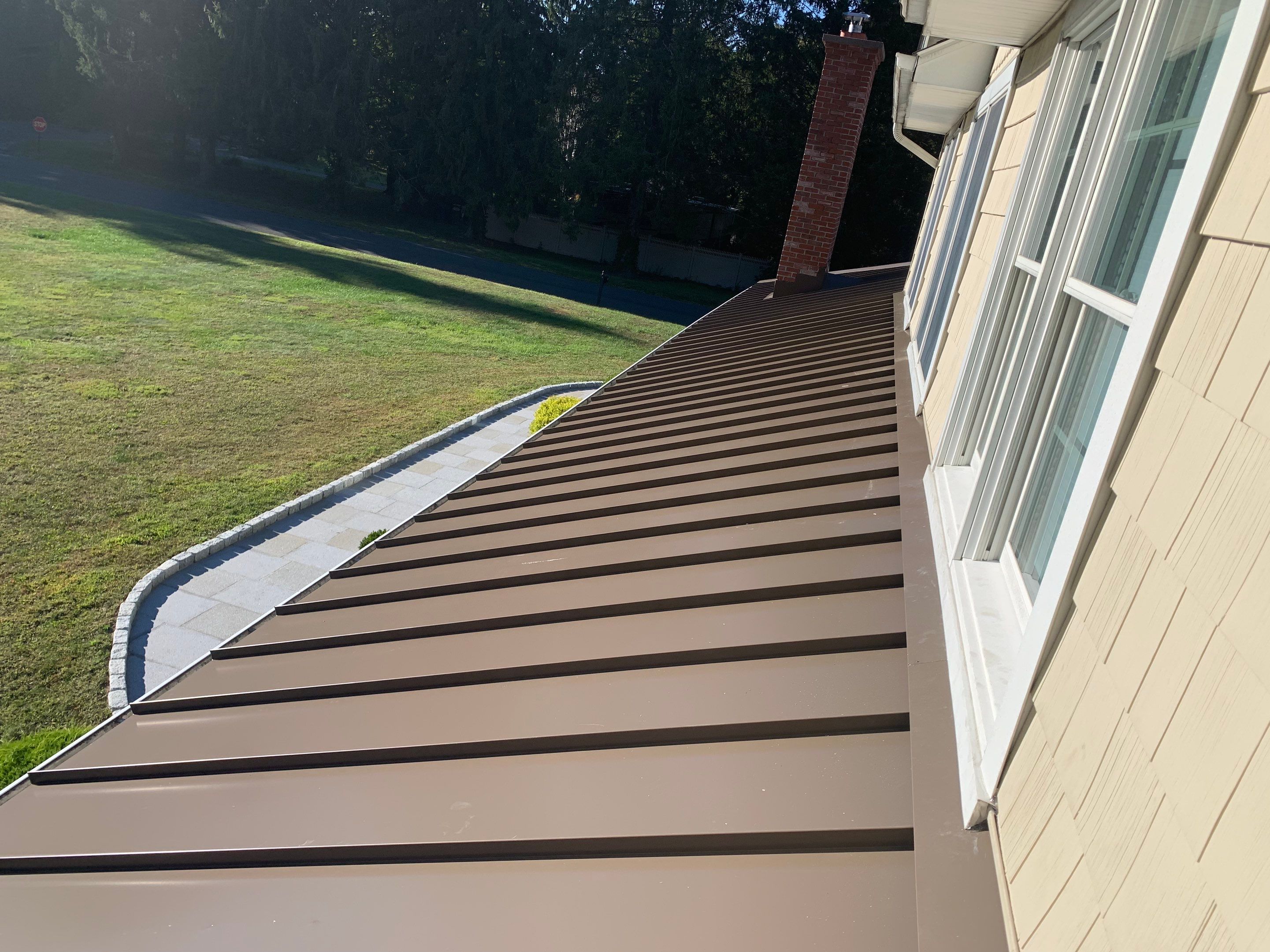 Asphalt & Standing Seam Metal Roof Replacement  by Lecla Home Improvements and Roofing INC