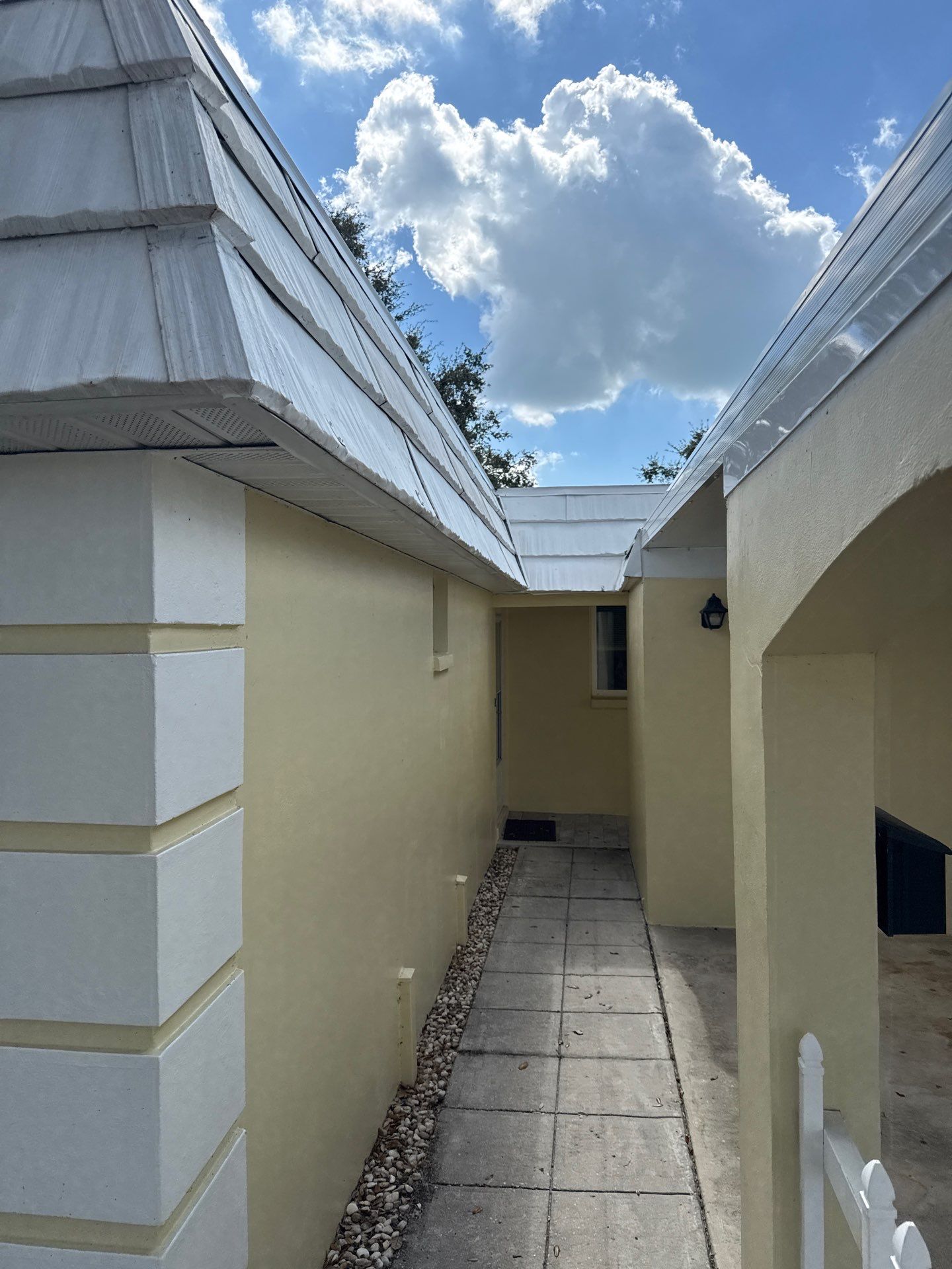 White Gutters and Matching Downspouts in Sarasota FL by Gutter Professors