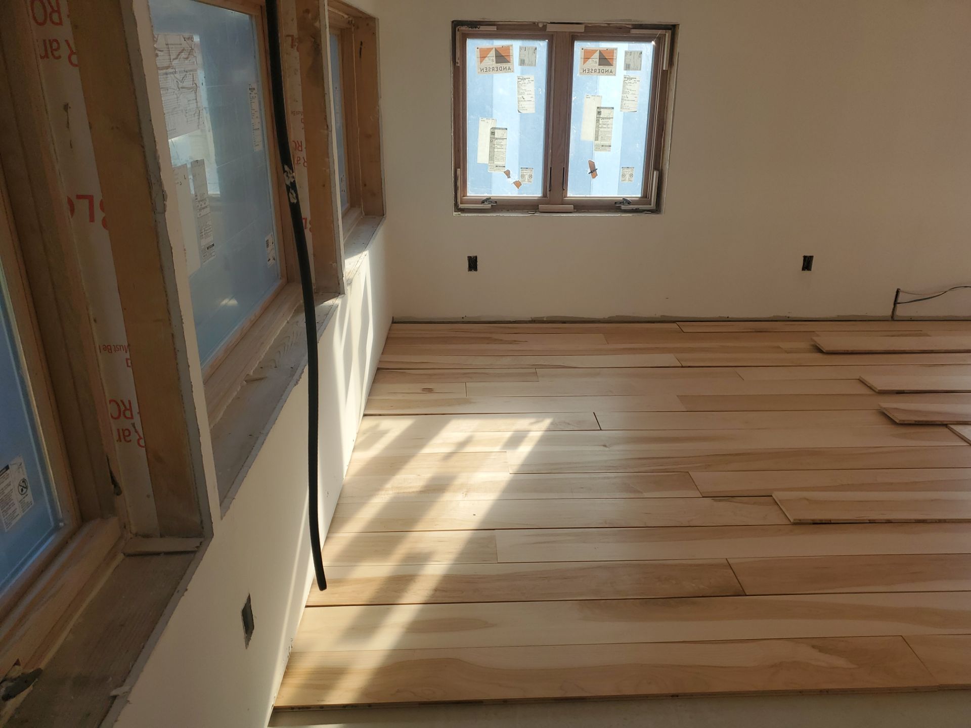 Full glue down Installation over radiant heat 7" Maple character grade by Ann Arbor Hardwoods 