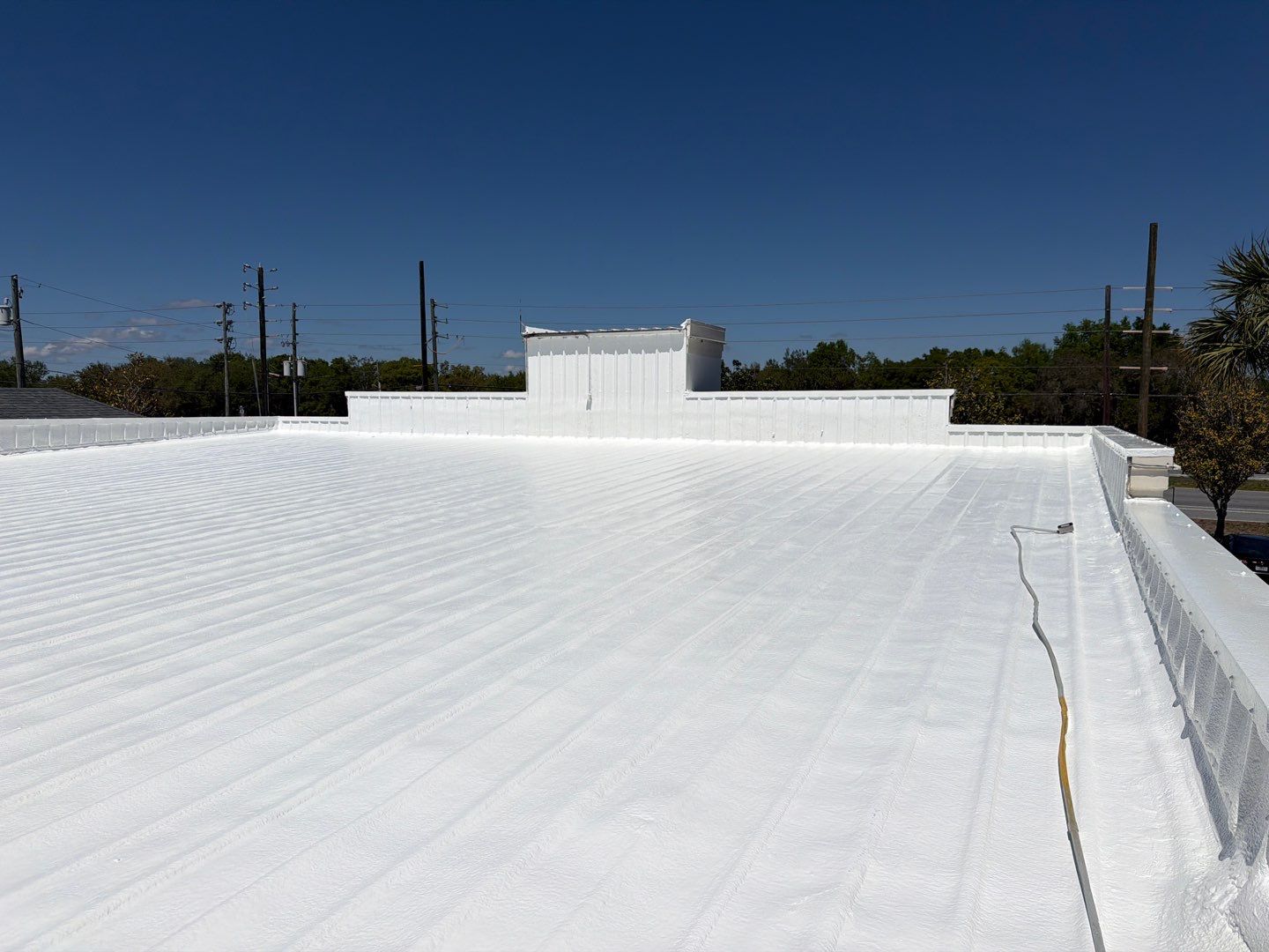 Silicone Roof Restoration for Commercial Metal Building in Lutz by CES Roofing