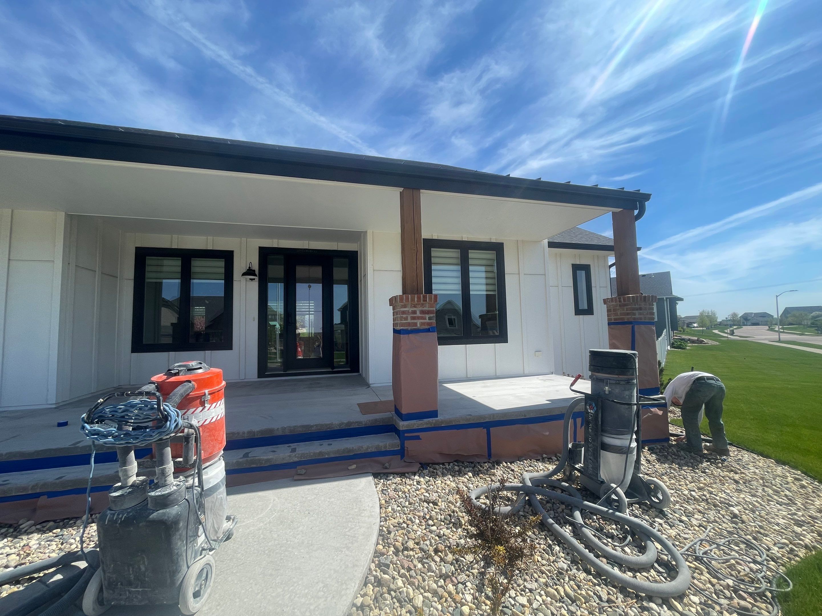 Grey Speckled Concrete Porch Coating for Sioux Falls Home by Select Painting, Coatings & Garage Cabinets