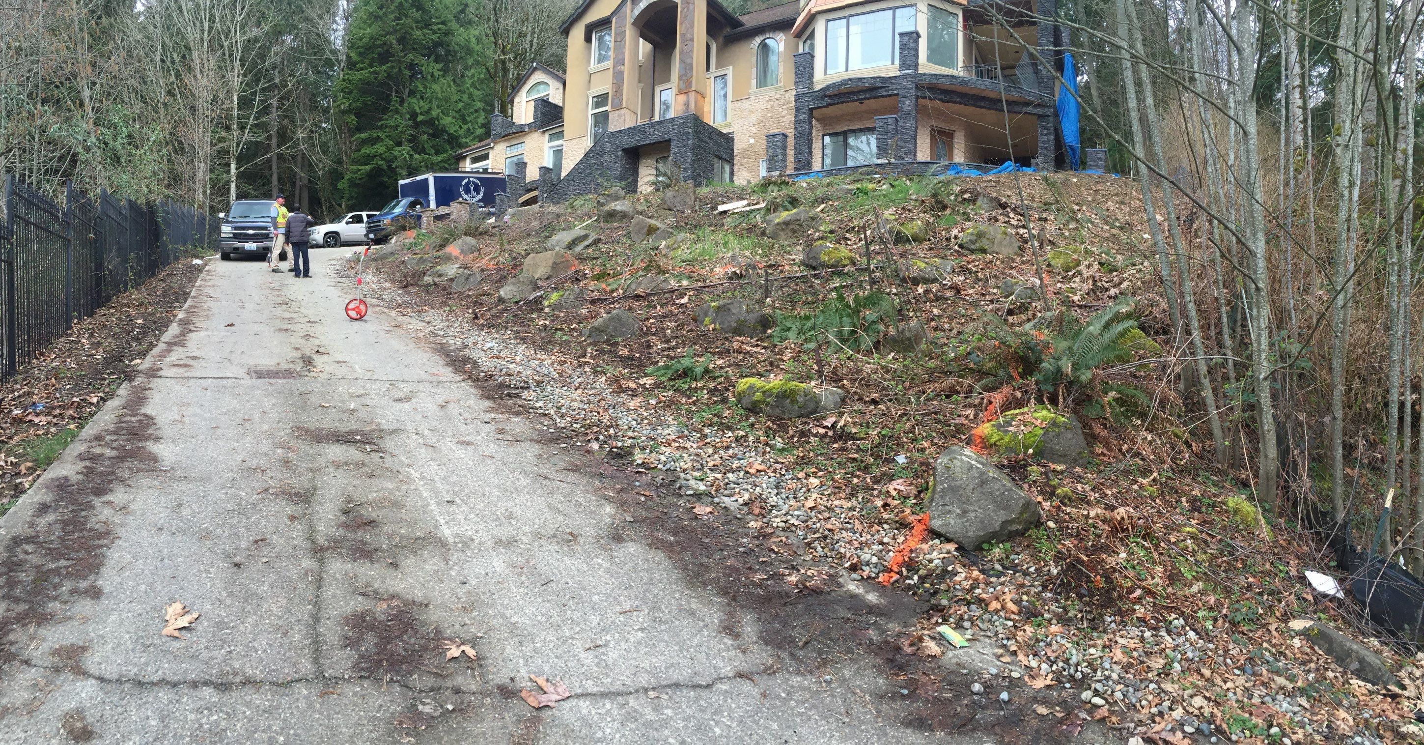 Asphalt Driveway and Stamped Concrete Patio Finish  by Jireh Asphalt & Concrete Inc 