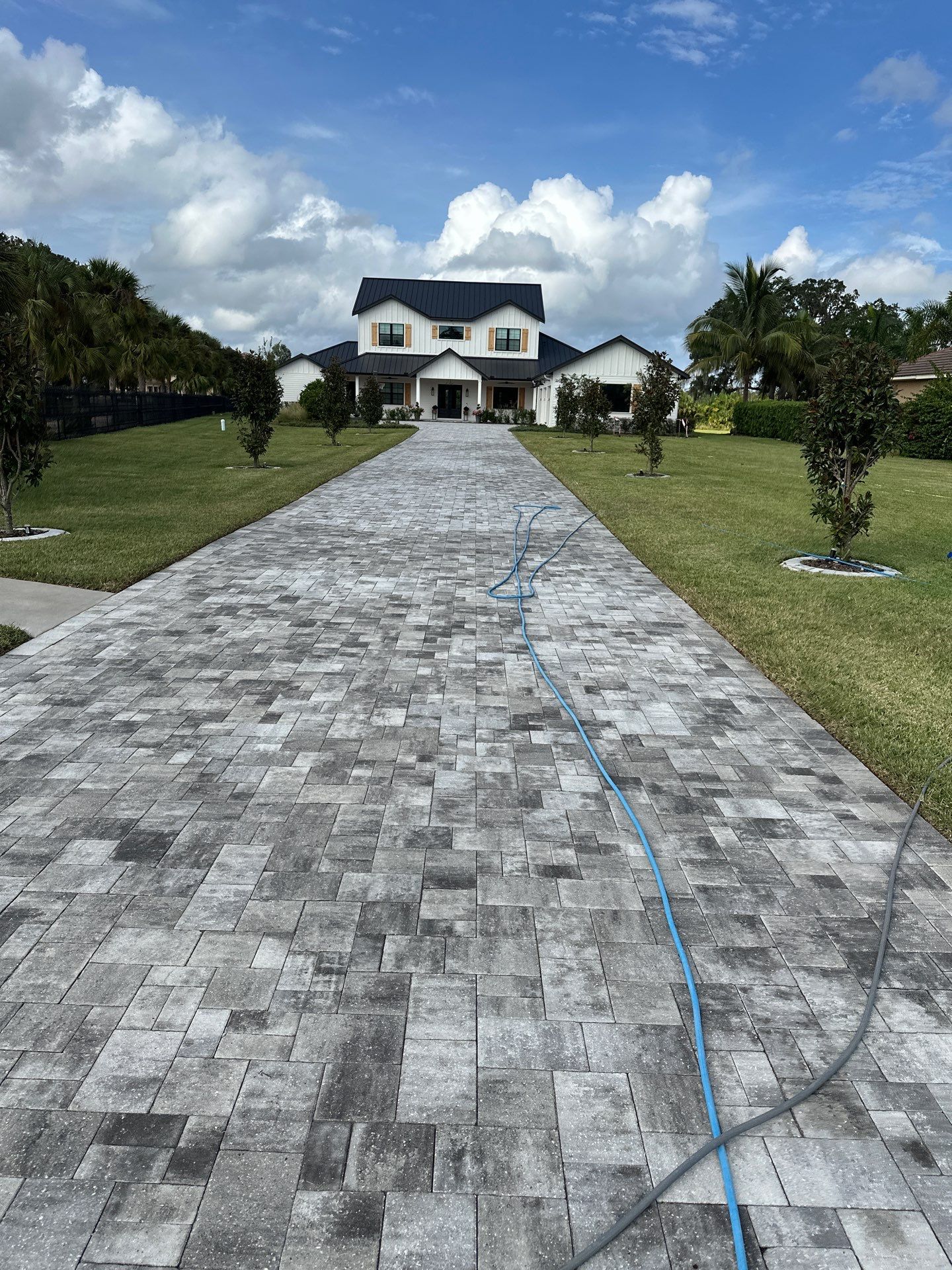 Complete Two-Story House Wash and Driveway Cleaning in Winding River Community, Bradenton, FL by Sunshine AquaWash