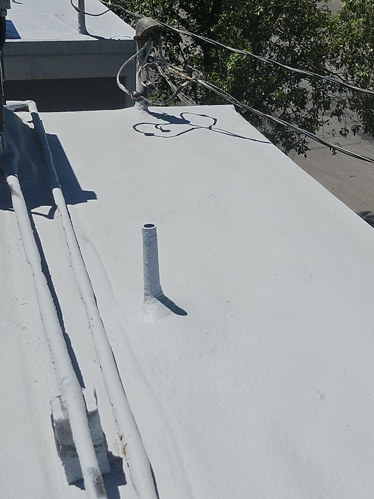 Foam Refurbish using General Coatings acrylic coatings and spray foam by Straight Edge Roofing Inc