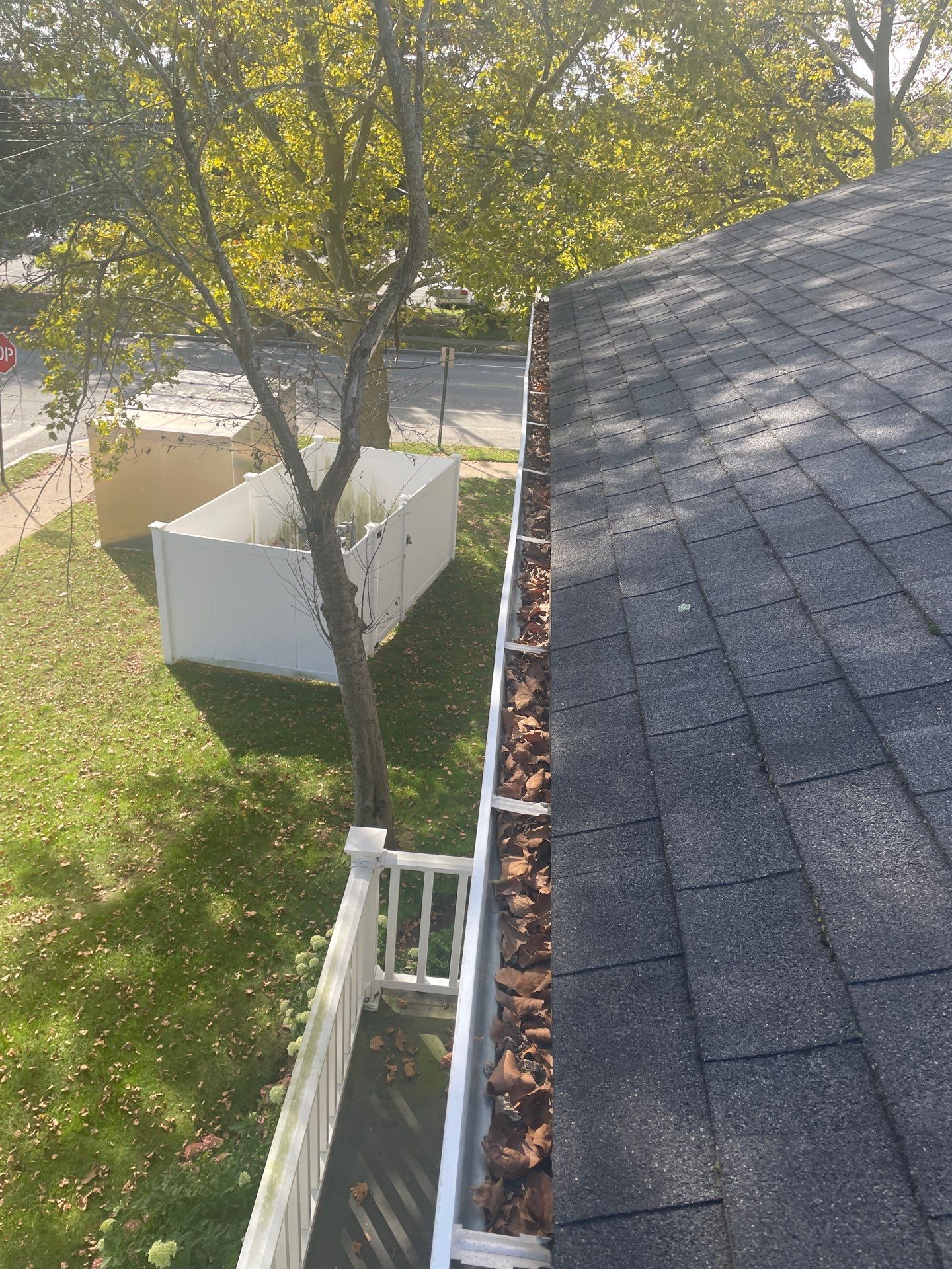 Commercial gutter cleaning Providence, RI before photo with filled gutters
