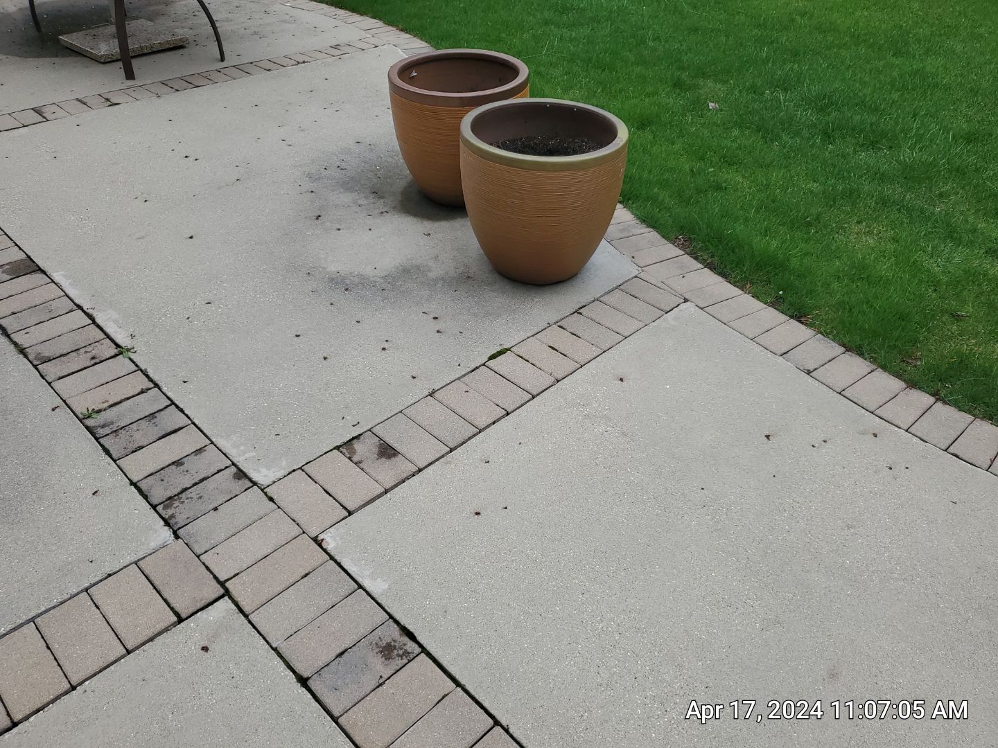 concrete patio and driveway cleaning by Northern Power Washing LLC.