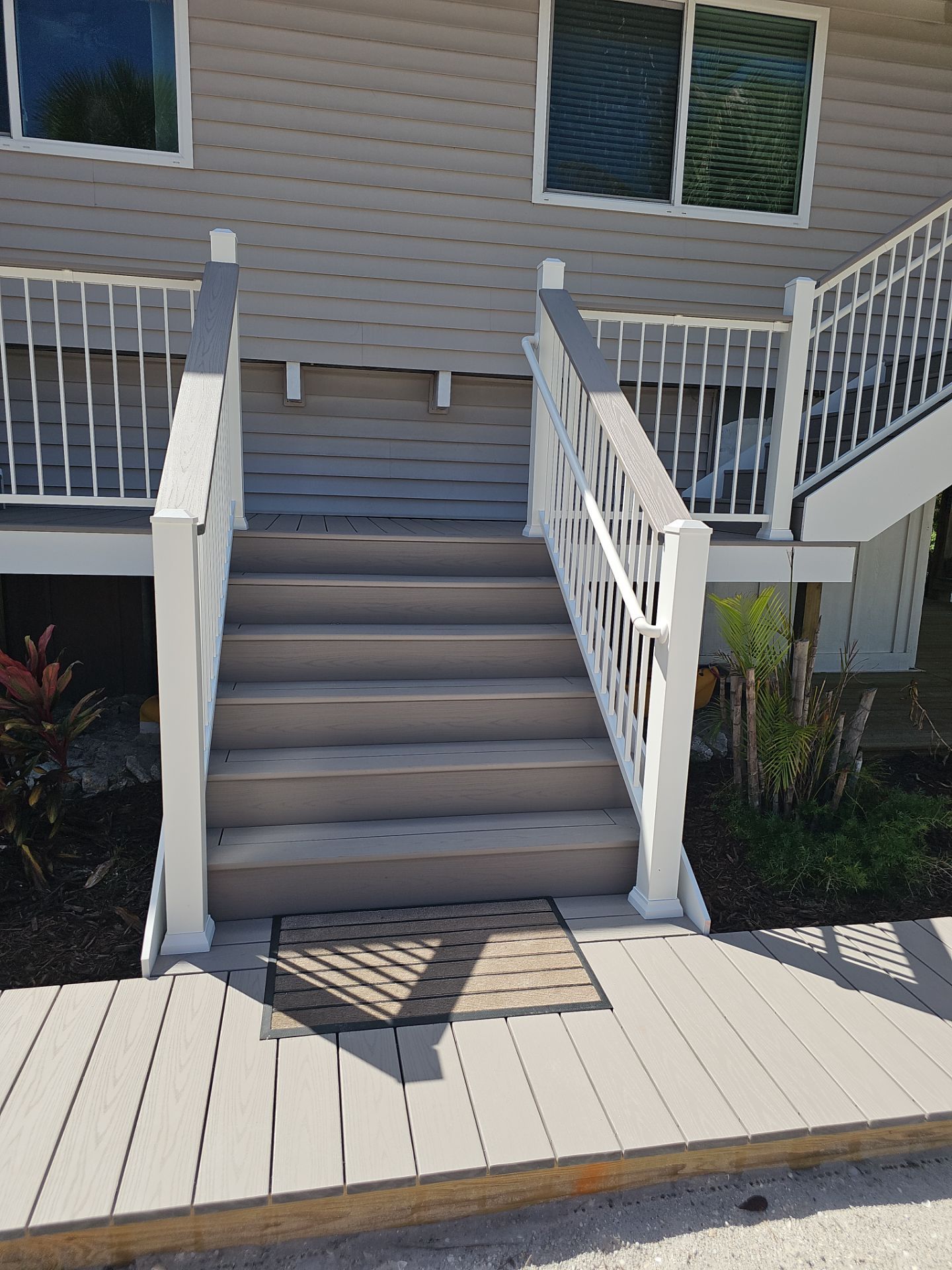 Elevated Composite Deck and Symmetrical Staircase Replacement in Englewood by Smirnov Construction Inc