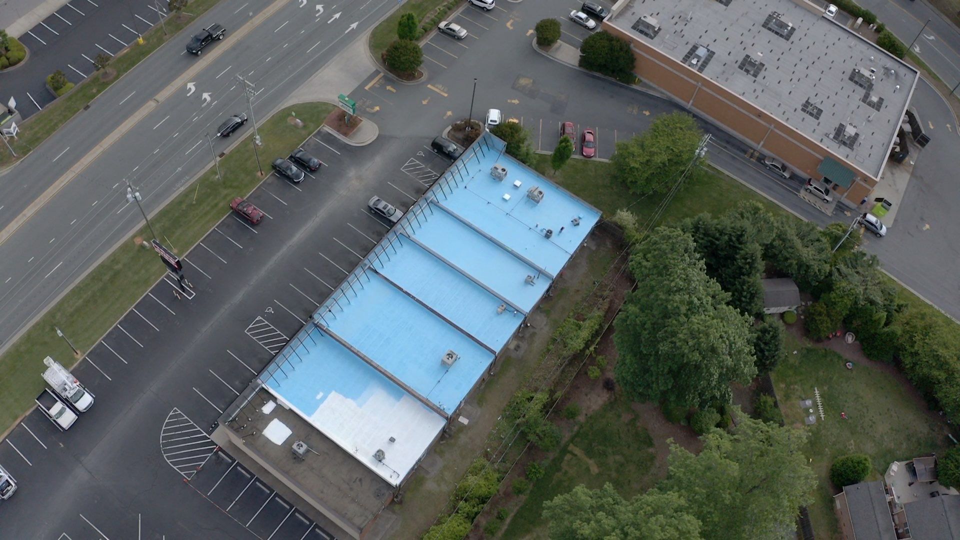Commercial Roof Coating using Fiberseal basecoat and Silicon Topcoat by Just In Time Roofing and Restoration